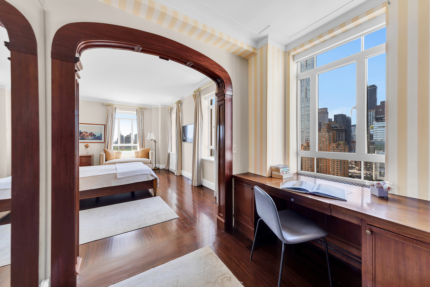 25 Central Park West, Unit 21J Manhattan, NY 10023 - Photo 24 of 37 a living room with a large bed and furniture