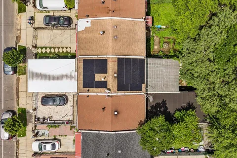 an aerial view of residential houses with outdoor space
