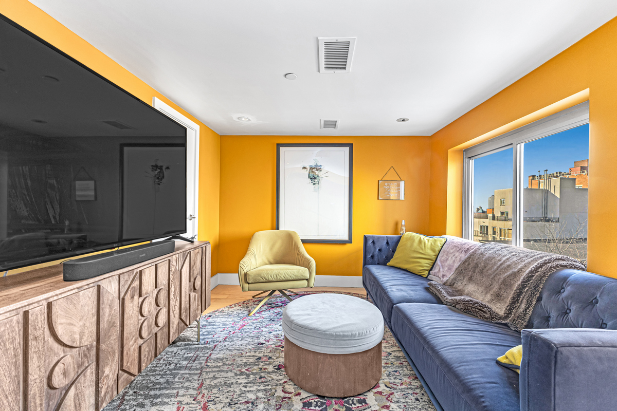 96 Woodpoint Road, Unit 3A Brooklyn, NY 11211 - Photo 8 of 15 a living room with furniture and a large window