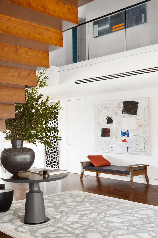 a bedroom with furniture and a potted plant