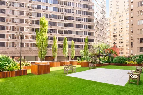 a view of a building with a big yard