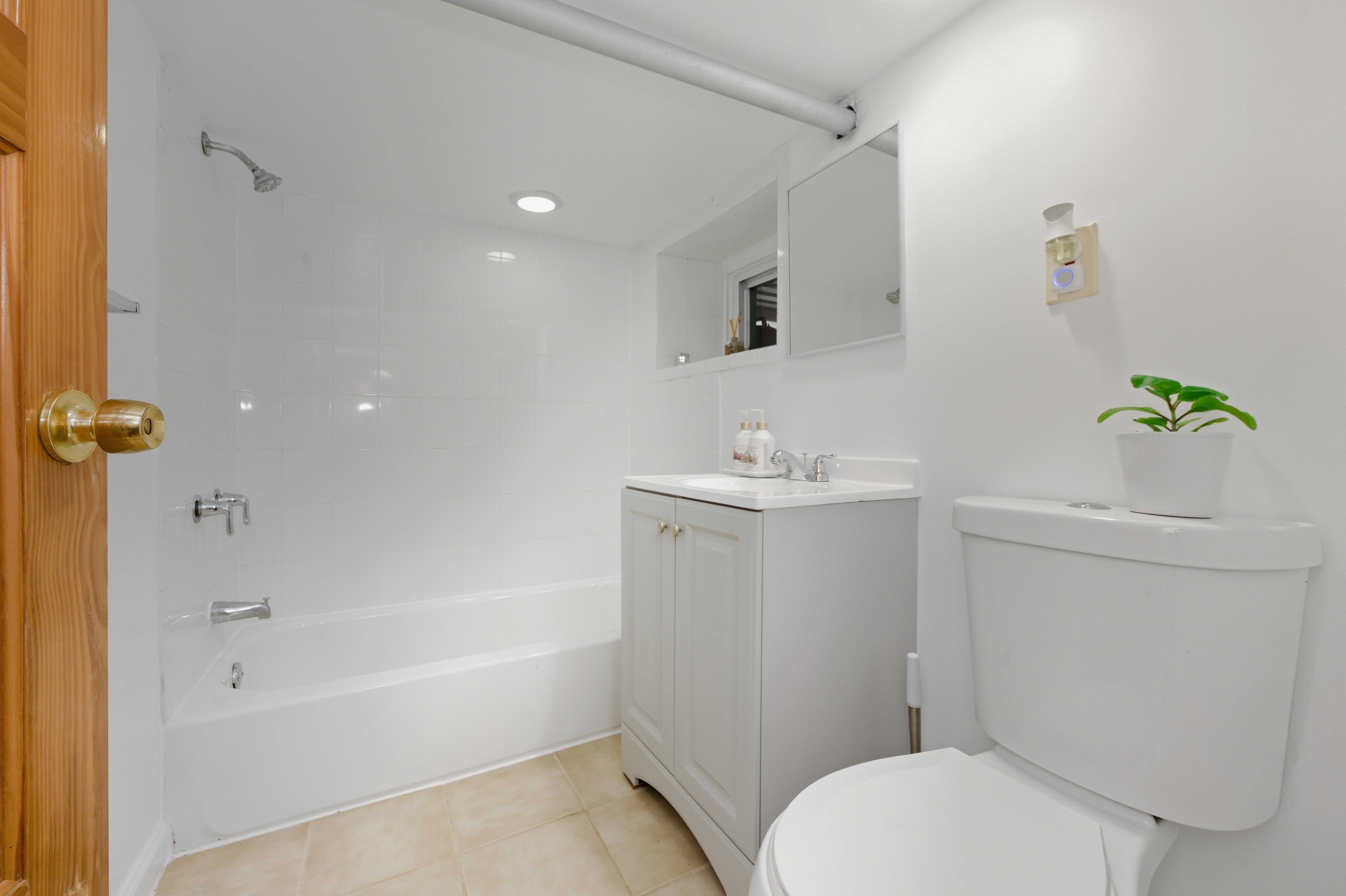 150-22 114th Road Queens, NY 11434 - Photo 12 of 22 a bathroom with a sink a toilet and shower