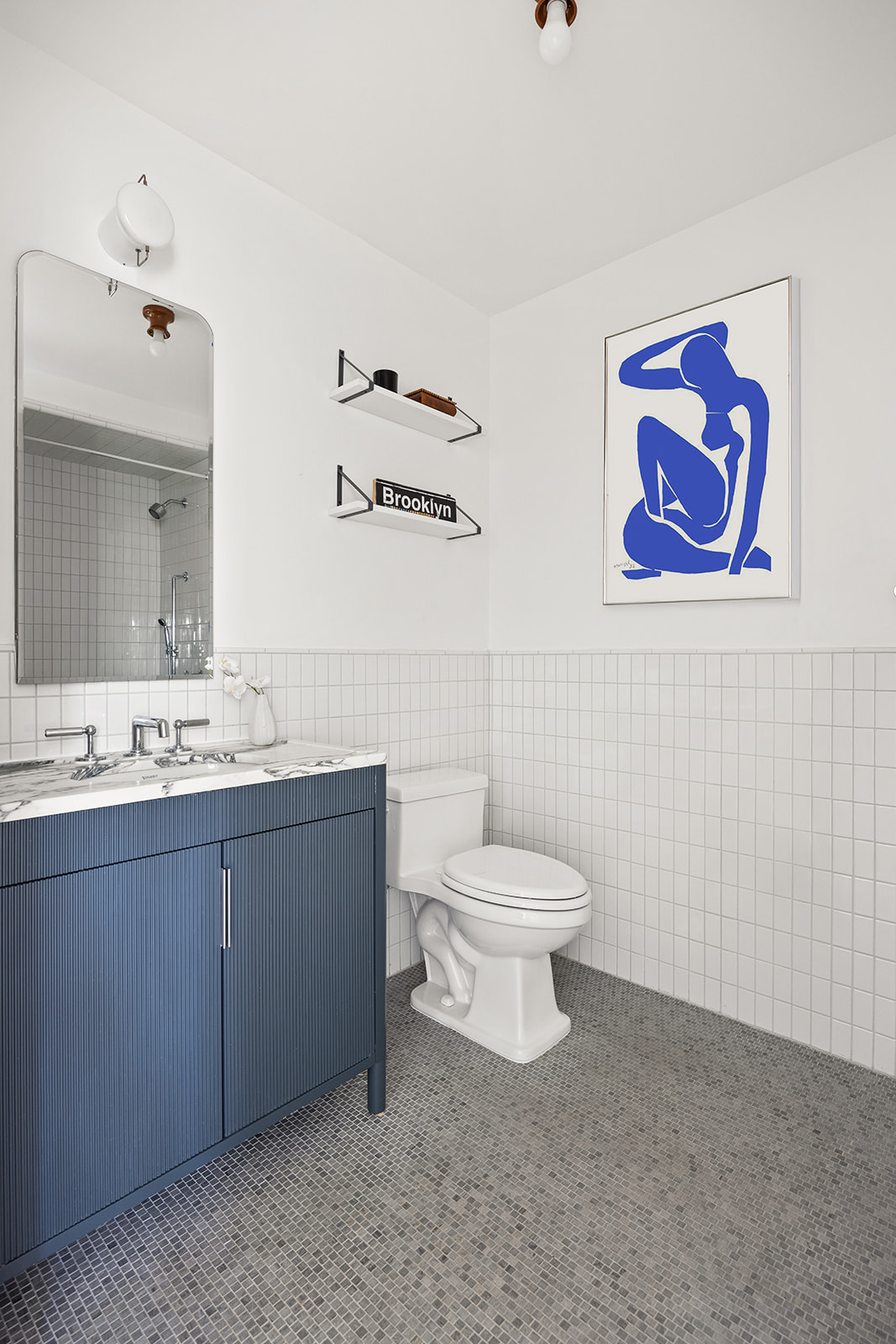 1 Prospect Park West, Unit 8C Brooklyn, NY 11215 - Photo 9 of 11 a bathroom with a toilet a sink and mirror