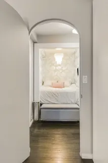 a bedroom with a bed and window