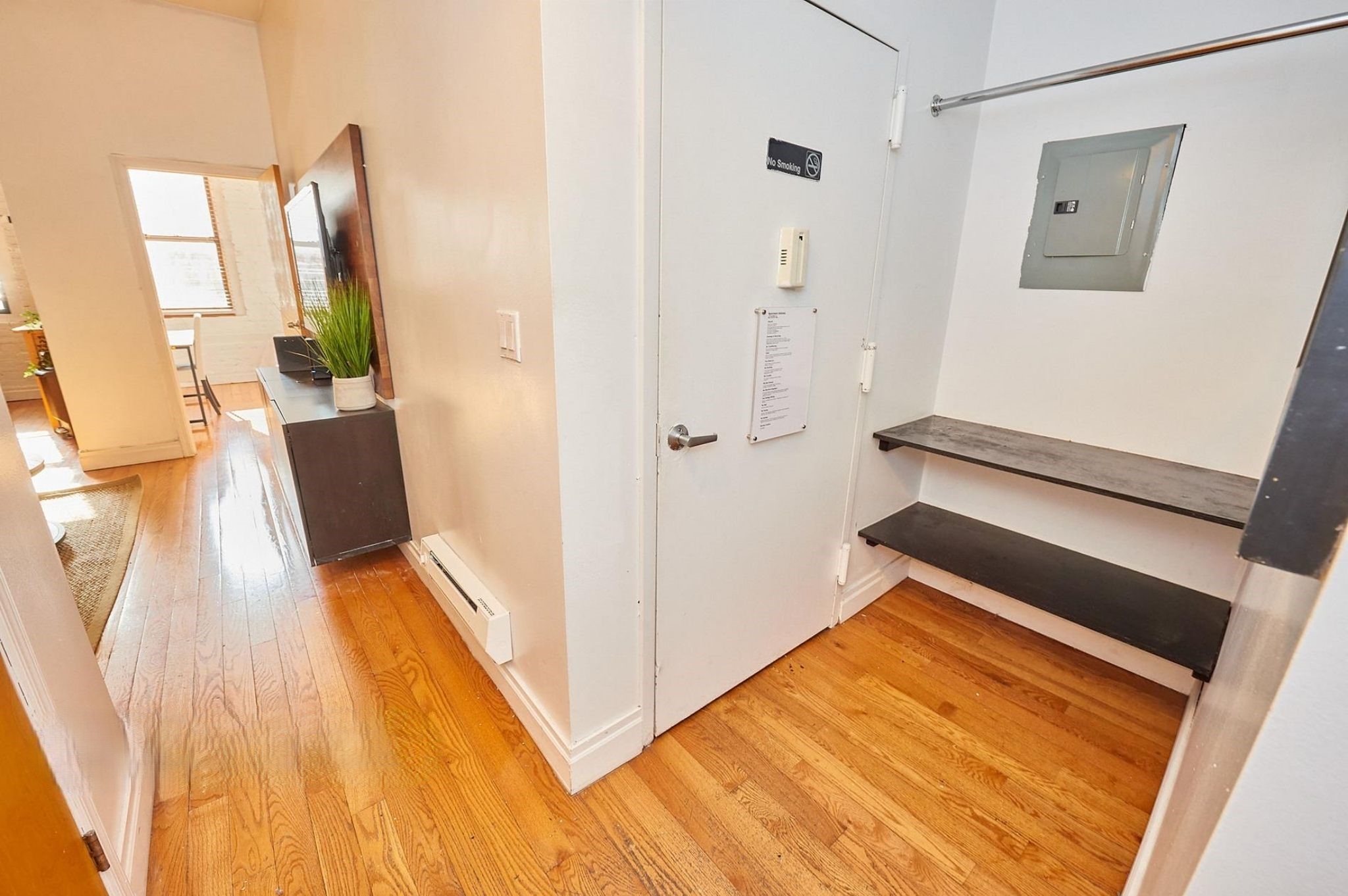 170 Elizabeth Street, Unit 1 Manhattan, NY 10012 - Photo 13 of 16 a view of a living room with furniture and wooden floor