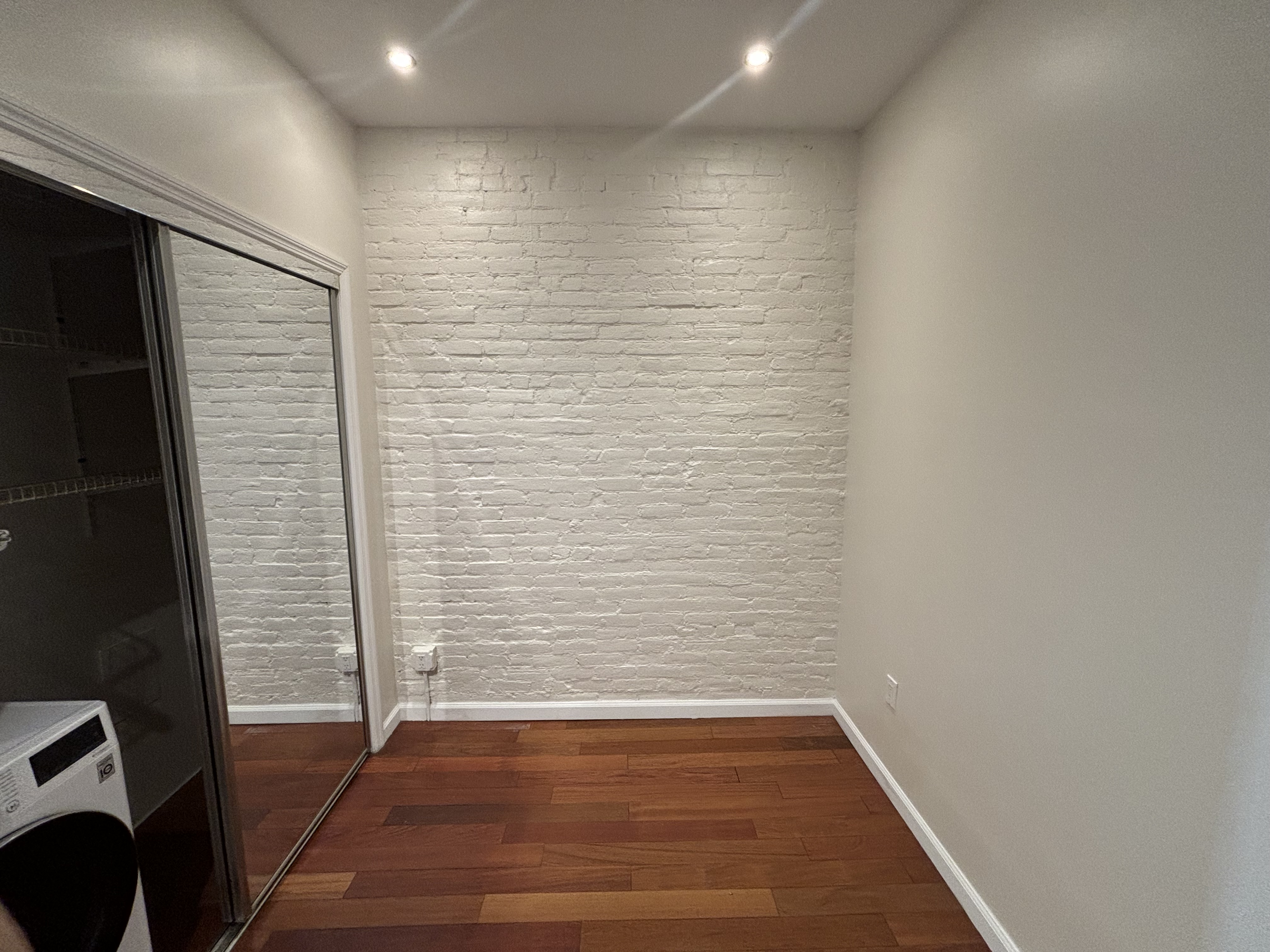 157 Rivington Street, Unit 4 Manhattan, NY 10002 - Photo 3 of 3 a view of wooden floor