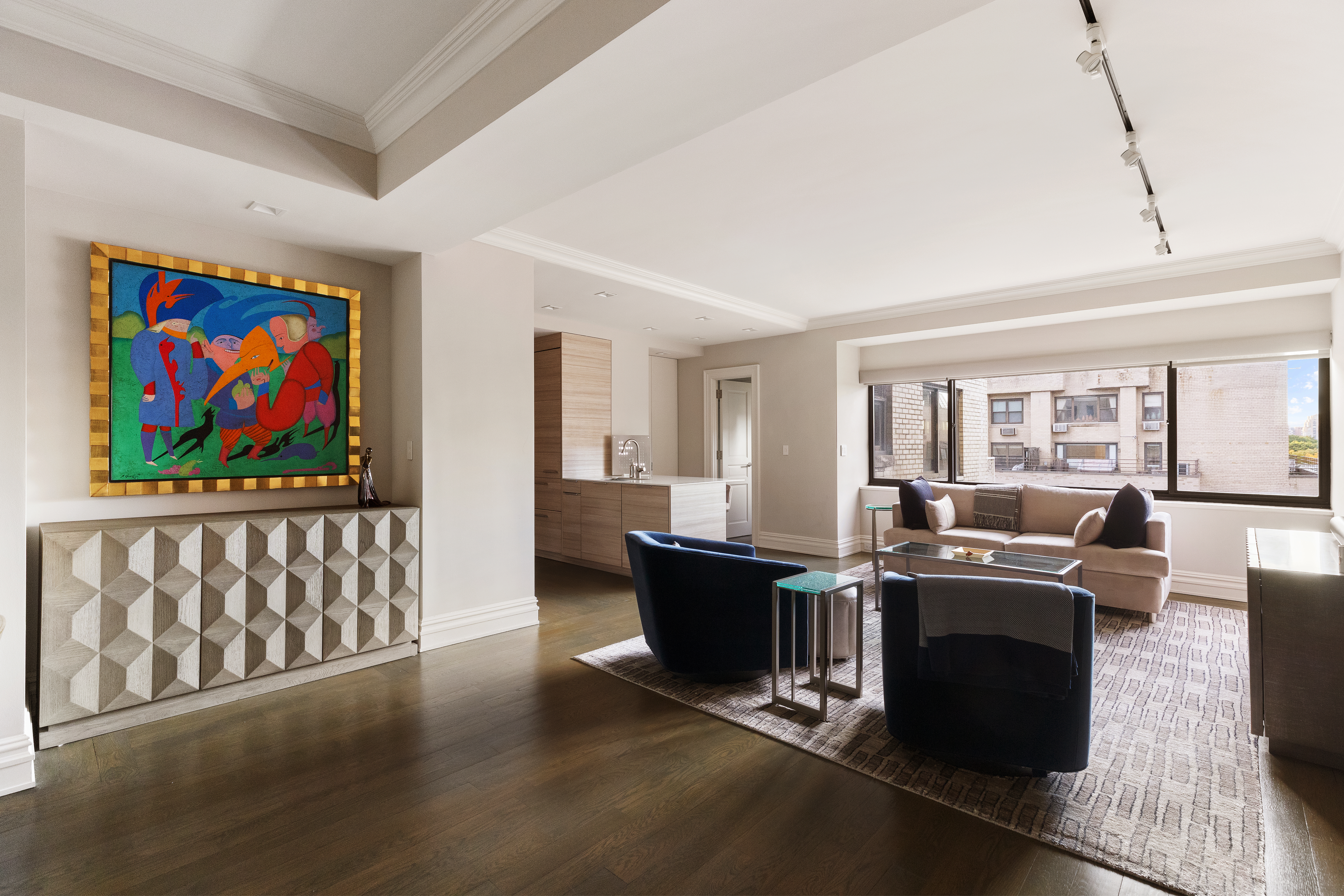 25 East 83rd Street, Unit 10D Manhattan, NY 10028 - Photo 2 of 17 a view of a livingroom with furniture wooden floor and windows