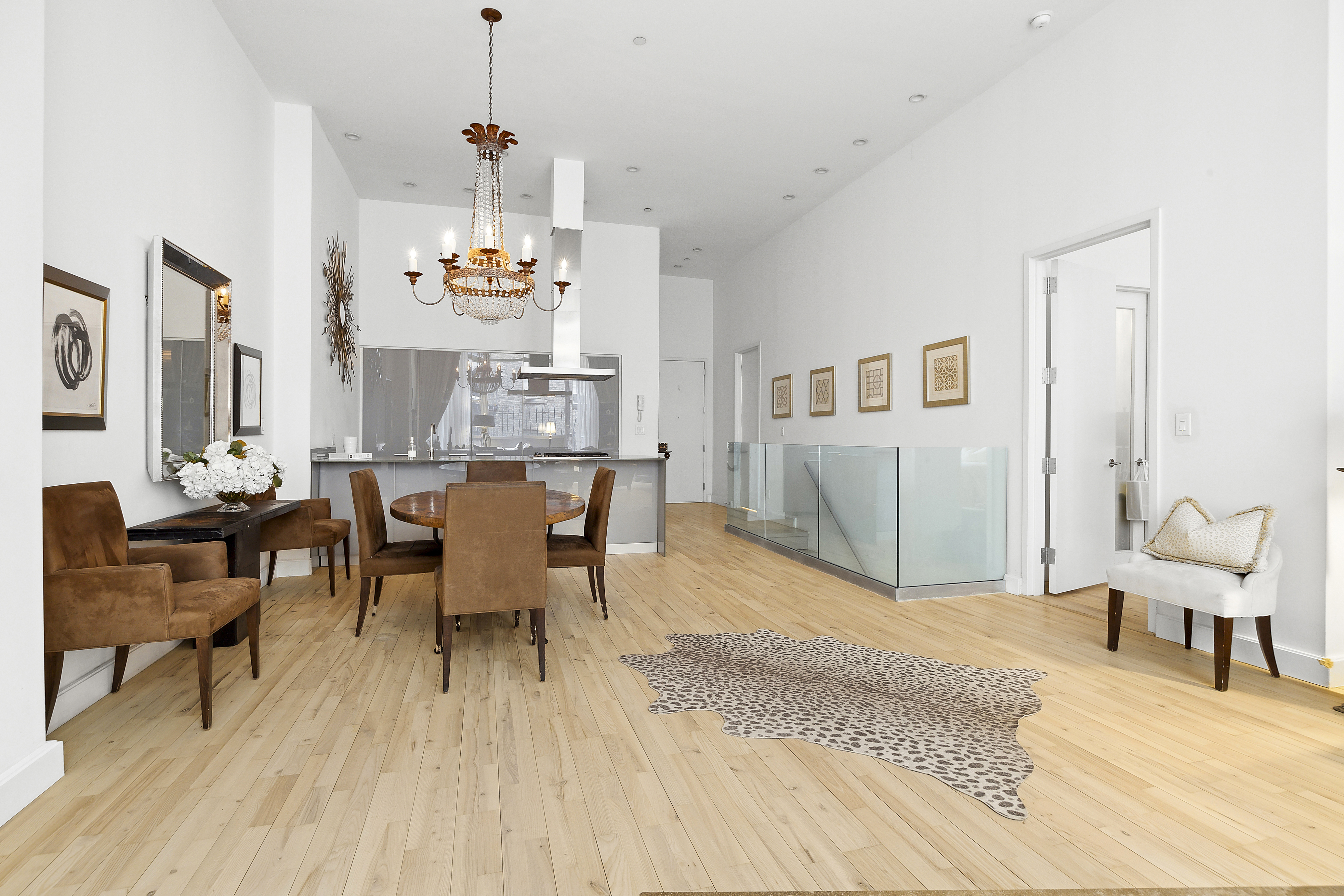 420 West 25th Street, Unit TH1E Manhattan, NY 10001 - Photo 3 of 22 a view of a livingroom with furniture window and wooden floor