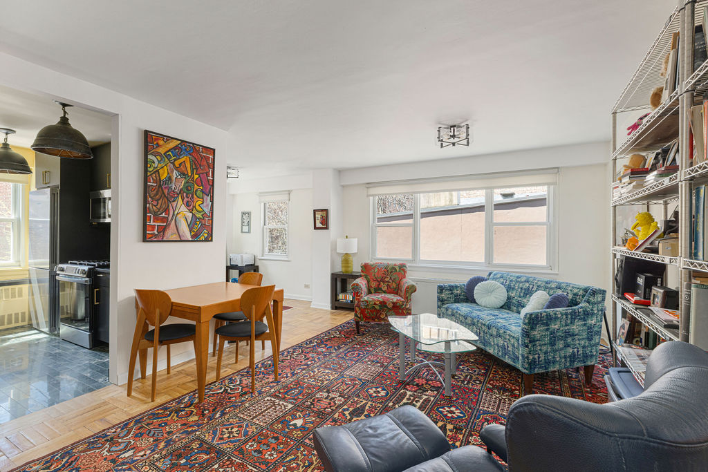 101 West 12th Street, Unit 5V Manhattan, NY 10011 - Photo 11 of 26 a living room with furniture workspace and a window