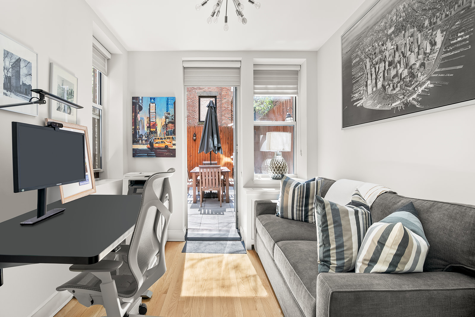 24 West 70th Street, Unit 1 Manhattan, NY 10023 - Photo 2 of 11 a living room with furniture a rug and a window