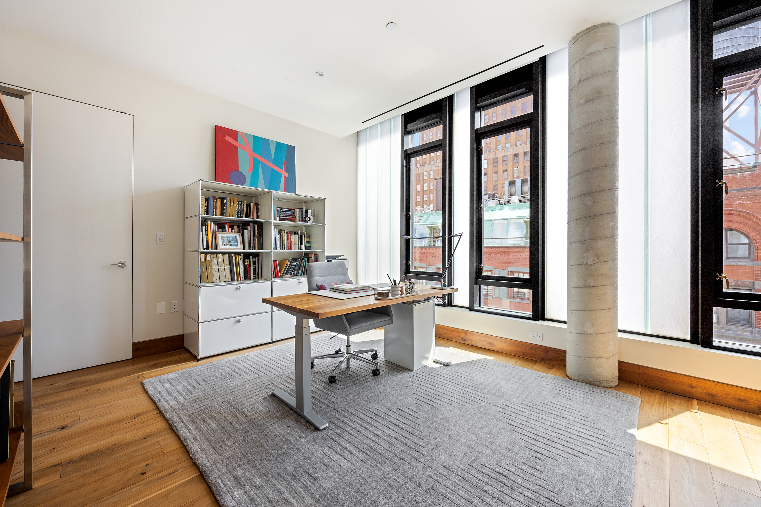 15 Leonard Street, Unit PH Manhattan, NY 10013 - Photo 27 of 37 a view of a workspace with furniture and a window