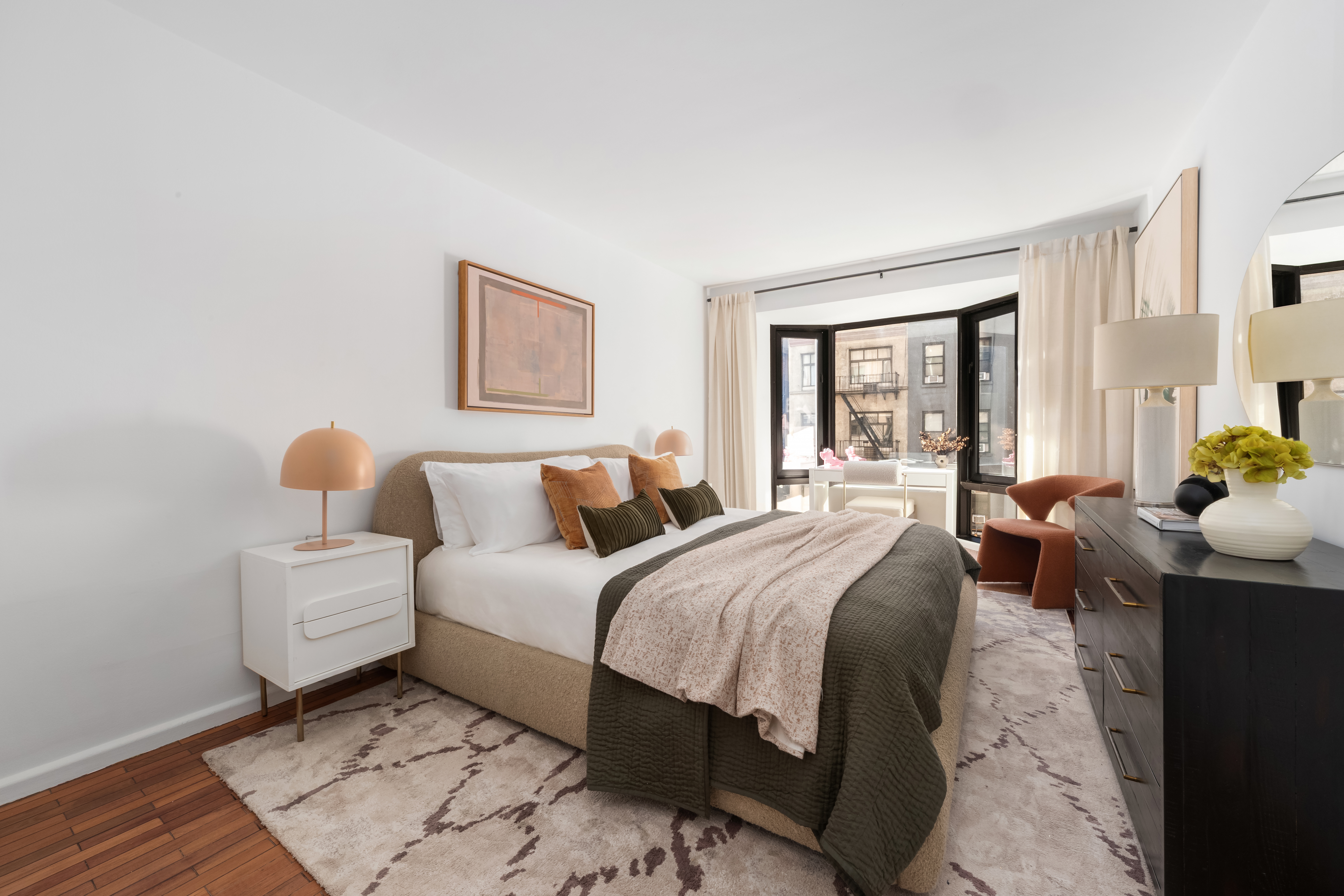 150 East 85th Street, Unit 3F Manhattan, NY 10028 - Photo 8 of 15 a bedroom with double bed and a window