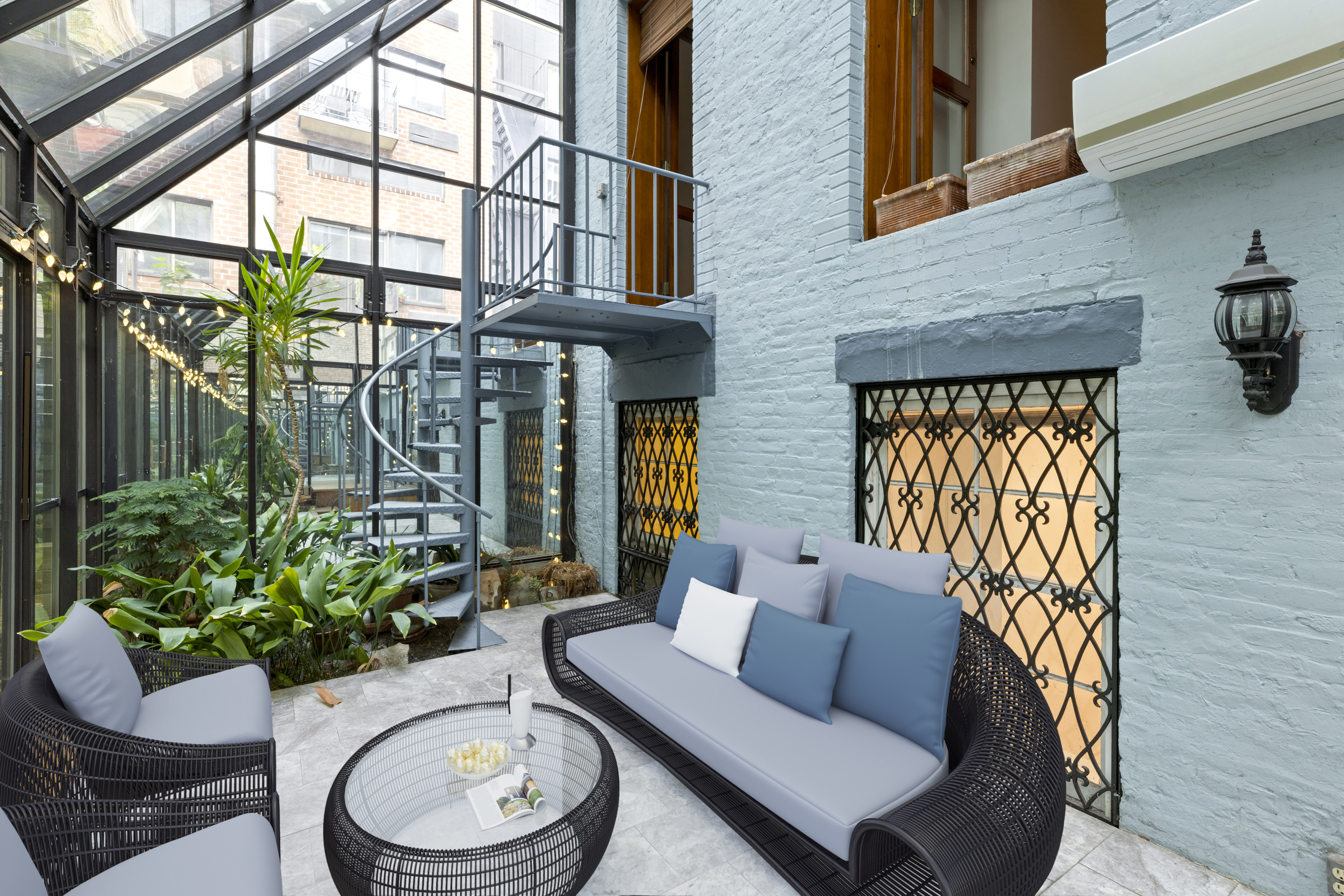 136 East 30th Street, Unit DUPLEX Manhattan, NY 10016 - Photo 10 of 26 a view of a patio with couches table and chairs and potted plants