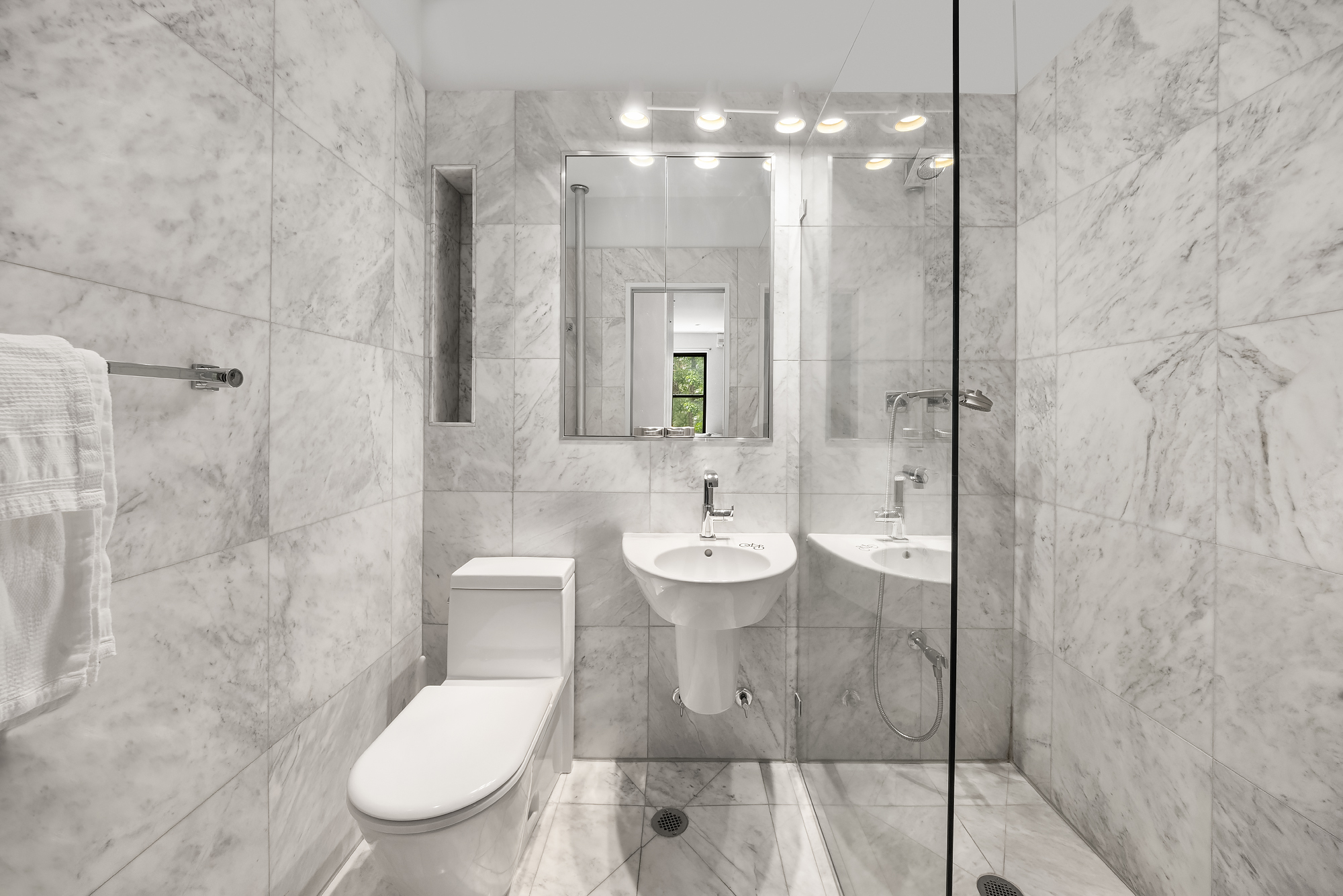 27 West 82nd Street, Unit 2B Manhattan, NY 10024 - Photo 8 of 11 a bathroom with a toilet sink and shower