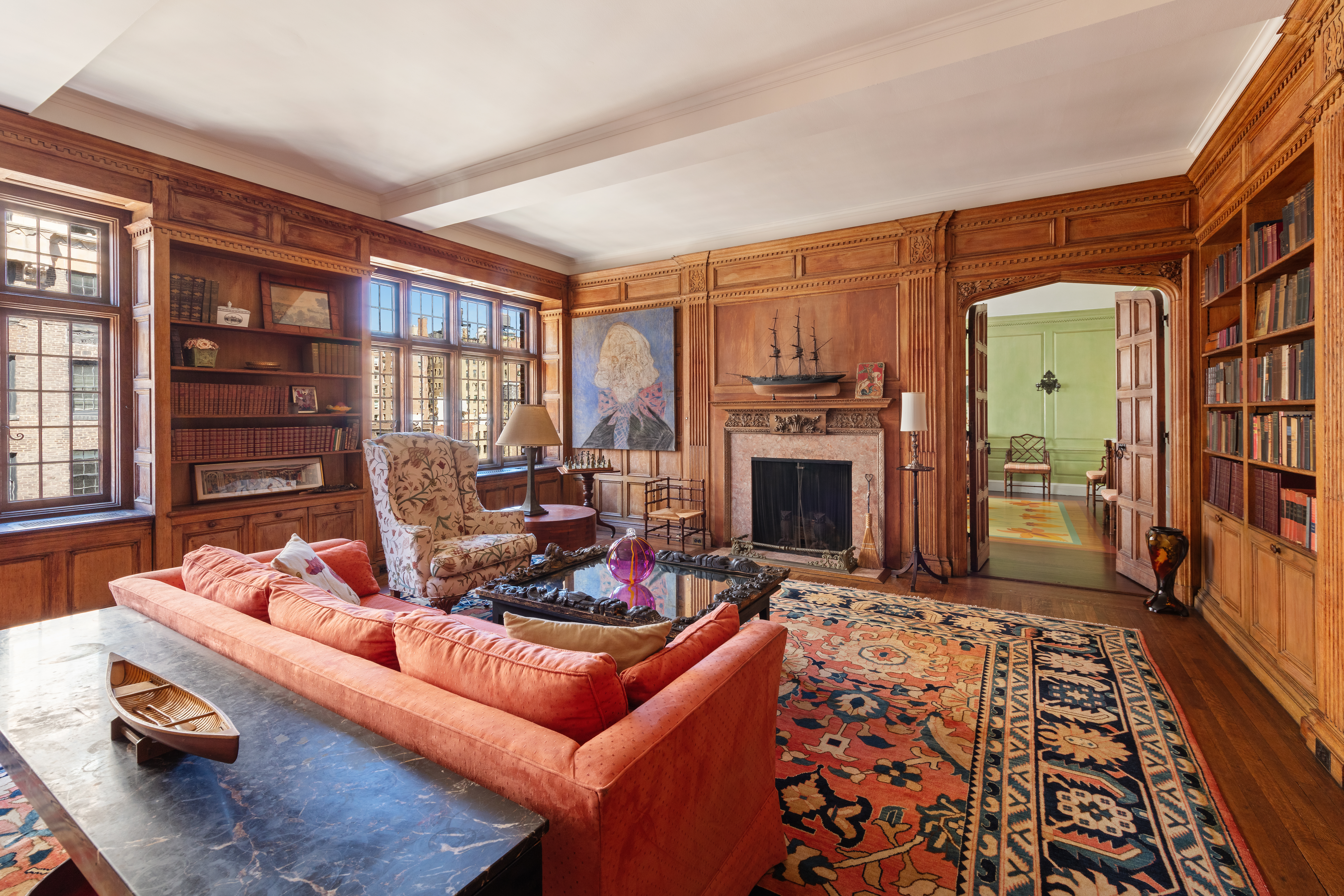 151 East 79th Street Manhattan, NY 10075 - Photo 3 of 15 a living room with furniture fireplace and flat screen tv