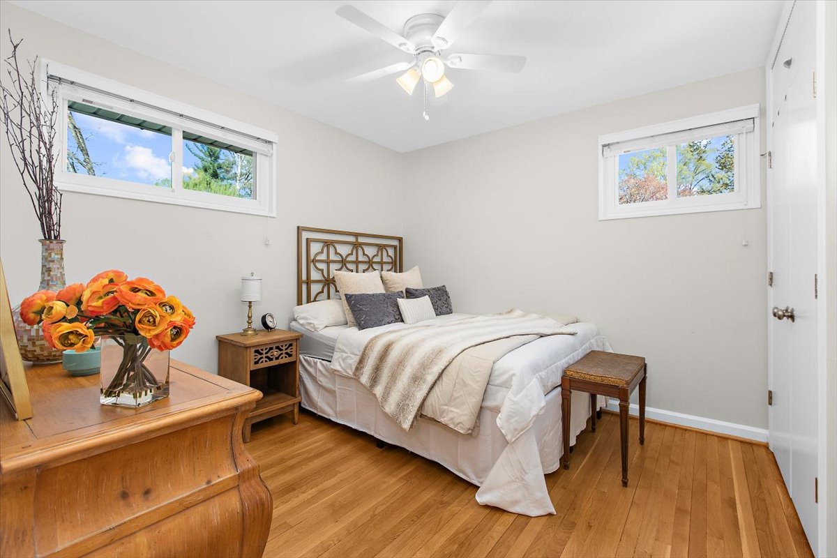 12712 Atherton Drive Silver Spring, MD 20906 - Photo 17 of 40 a bedroom with a bed and wooden floor