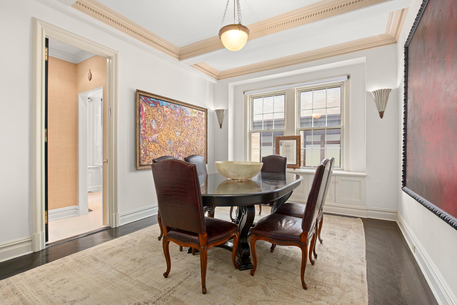 1140 5th Avenue, Unit 8C Manhattan, NY 10128 - Photo 8 of 16 a view of a dining room with furniture window and wooden floor