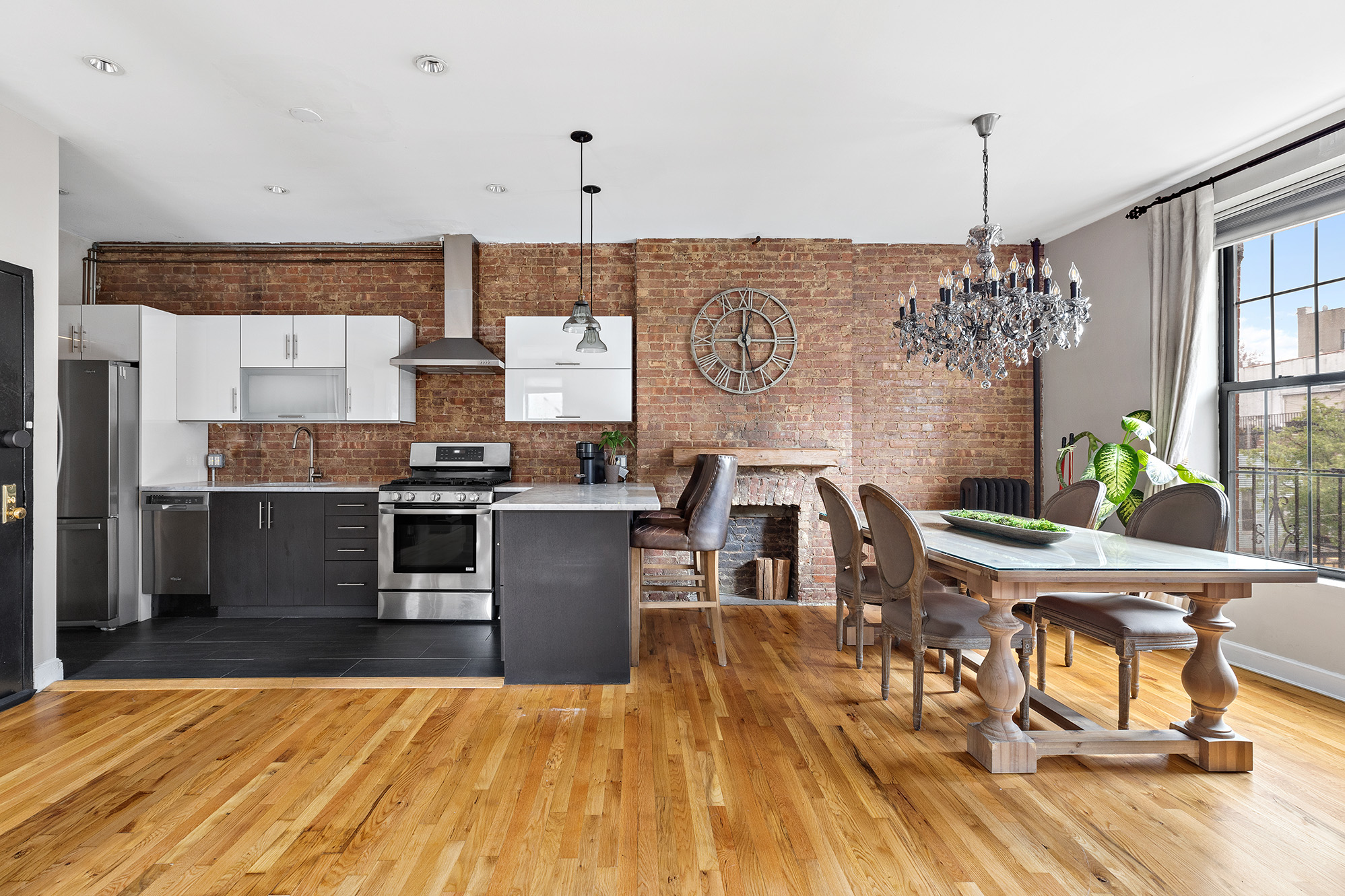 a view of a dining room with furniture window and wooden floor