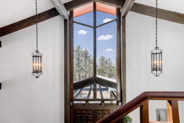 a view of a living room a window and wooden floor