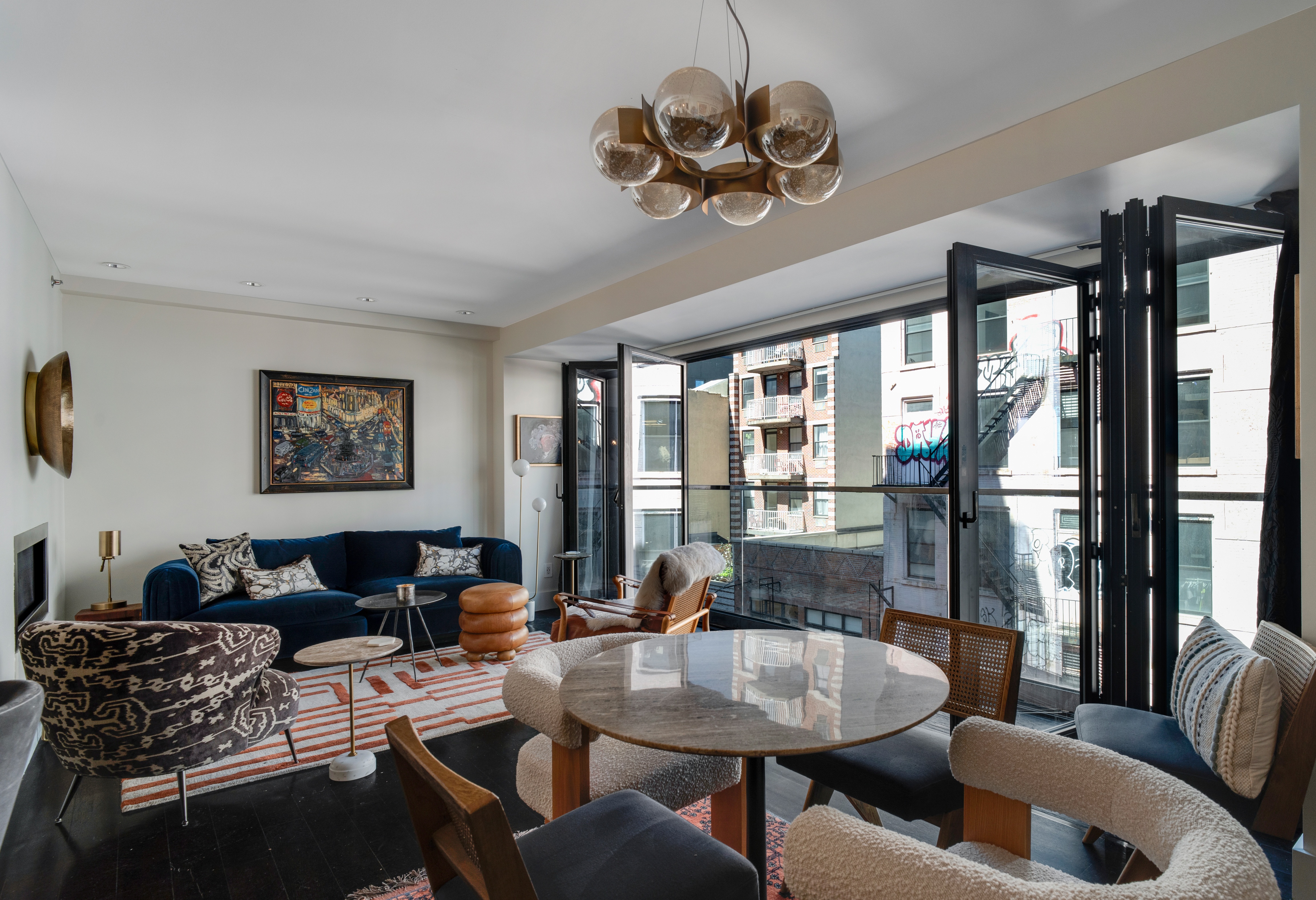 60 Orchard Street, Unit 4 Manhattan, NY 10002 - Photo 2 of 18 a living room with furniture or outdoor view and a chandelier