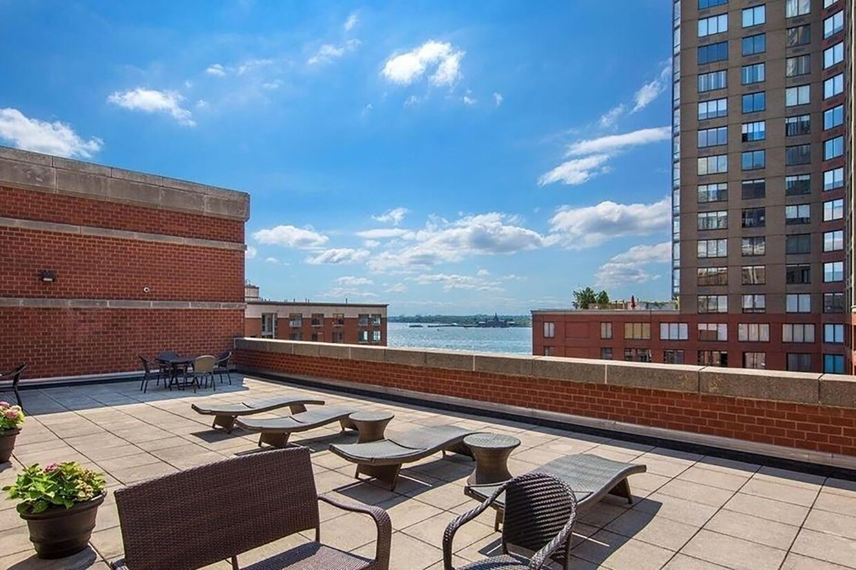 300 Rector Place, Unit 7F Manhattan, NY 10280 - Photo 6 of 10 a view of balcony with furniture