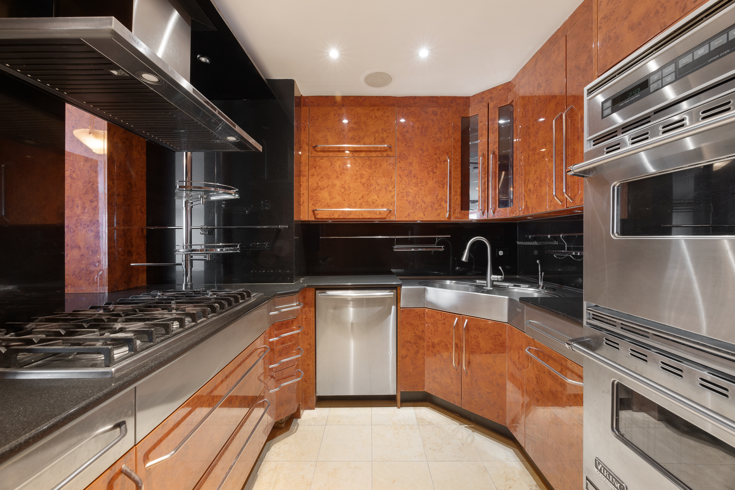 530 East 76th Street, Unit PH36/37E Manhattan, NY 10021 - Photo 8 of 29 a kitchen with stainless steel appliances granite countertop a sink and a stove