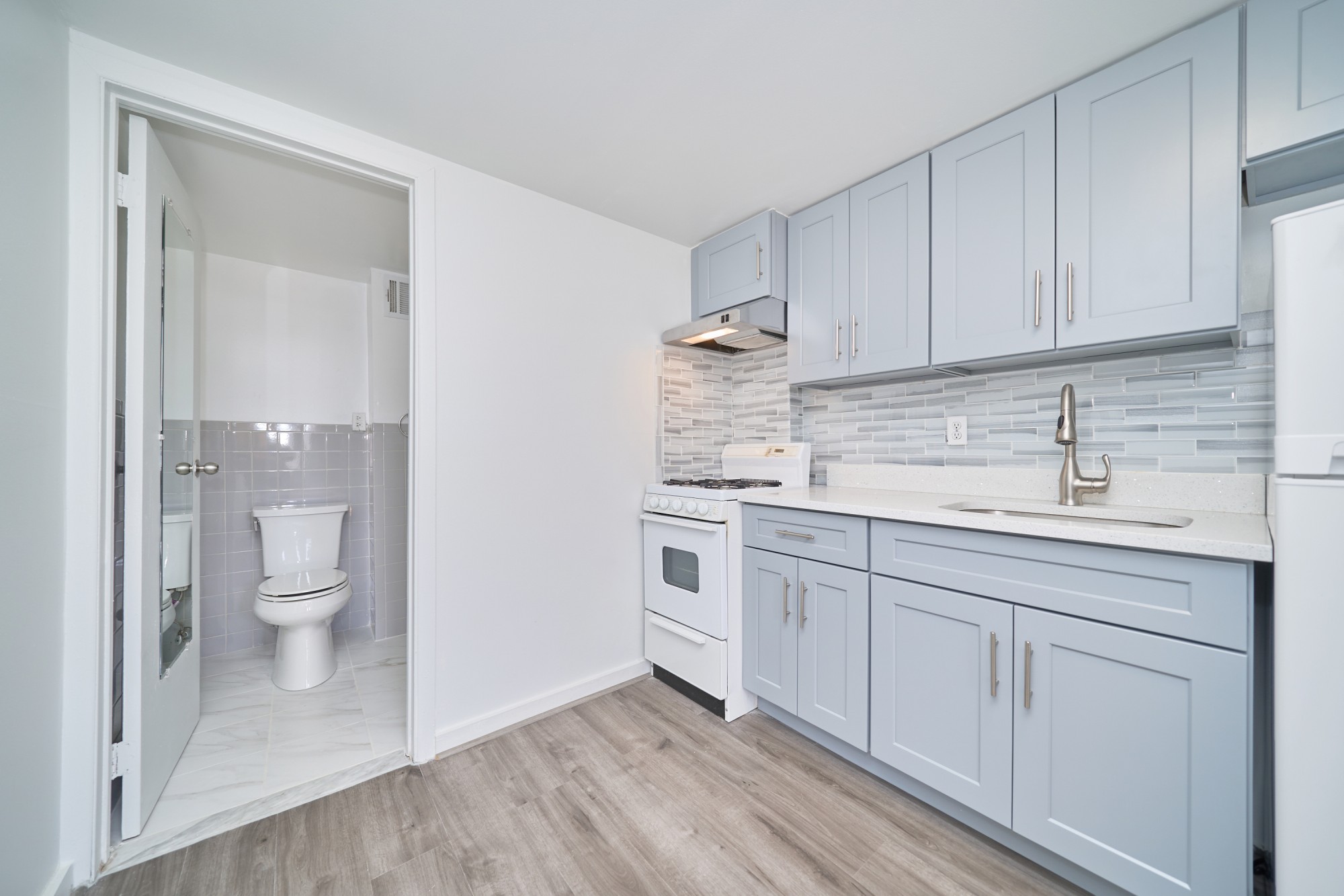 357 West 120th Street, Unit 2F Manhattan, NY 10027 - Photo 7 of 8 a spacious bathroom with a granite countertop sink toilet and shower
