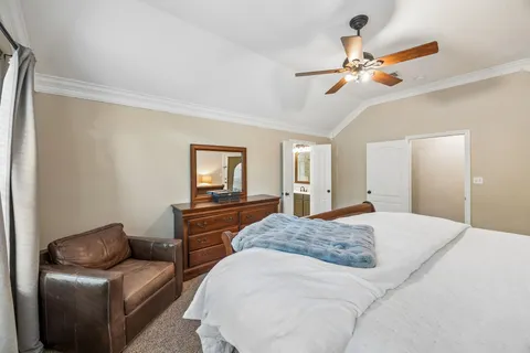 a bedroom with a large bed and furniture