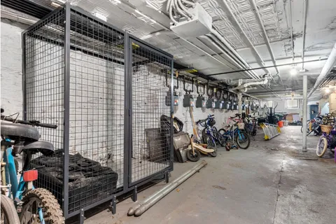 a view of a garage with a bike and car
