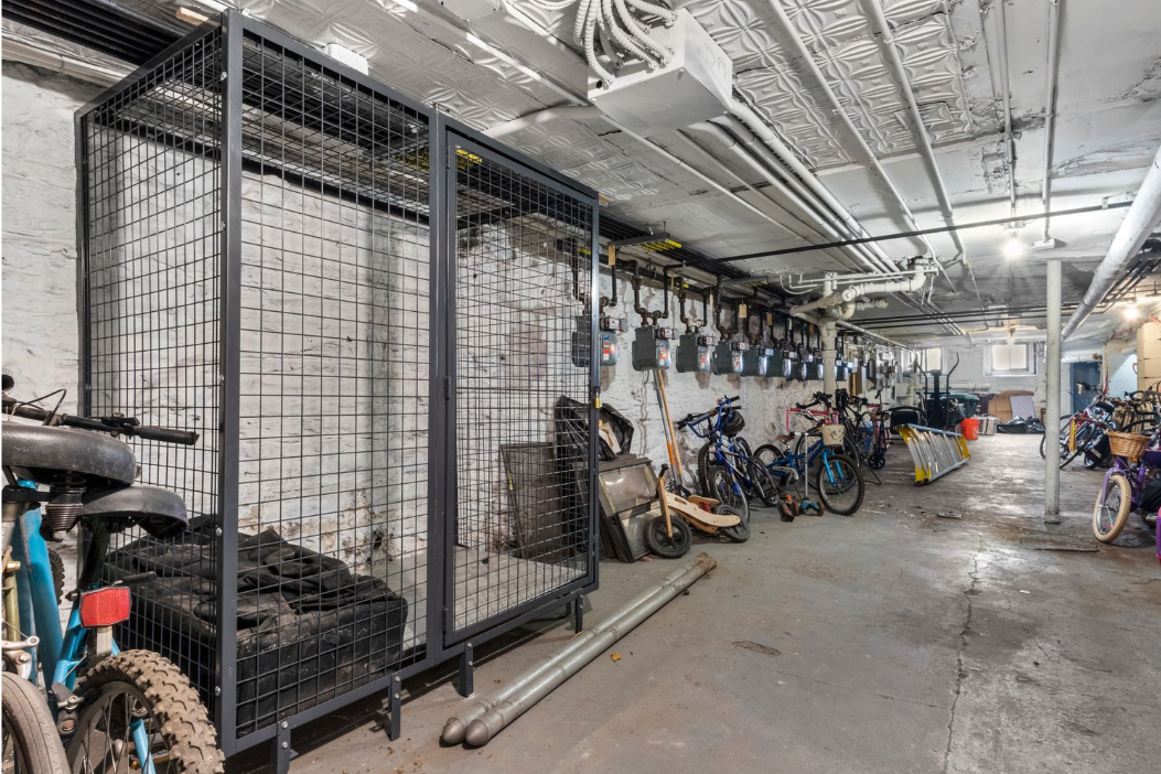 436 East 66th Street, Unit 4E Manhattan, NY 10065 - Photo 18 of 19 a view of a garage with a bike and car