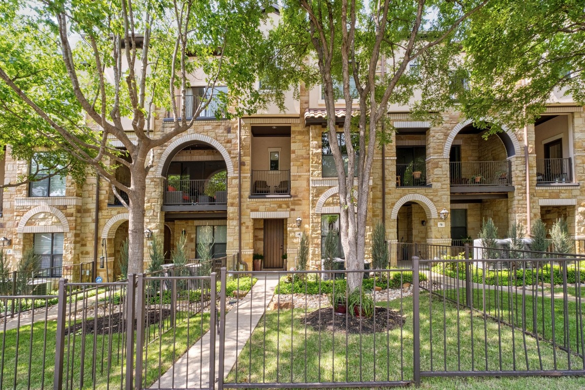2505 Enfield Road, Unit 4 Austin, TX 78703 - Photo 1 of 19 a front view of a house with a garden