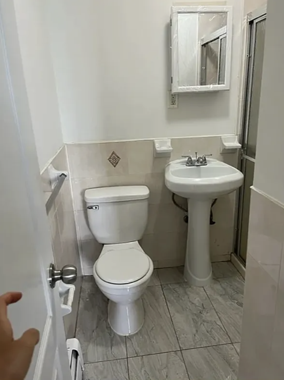 14 East 29th Street Brooklyn, NY 11226 - Photo 5 of 6 a bathroom with a sink toilet and a mirror