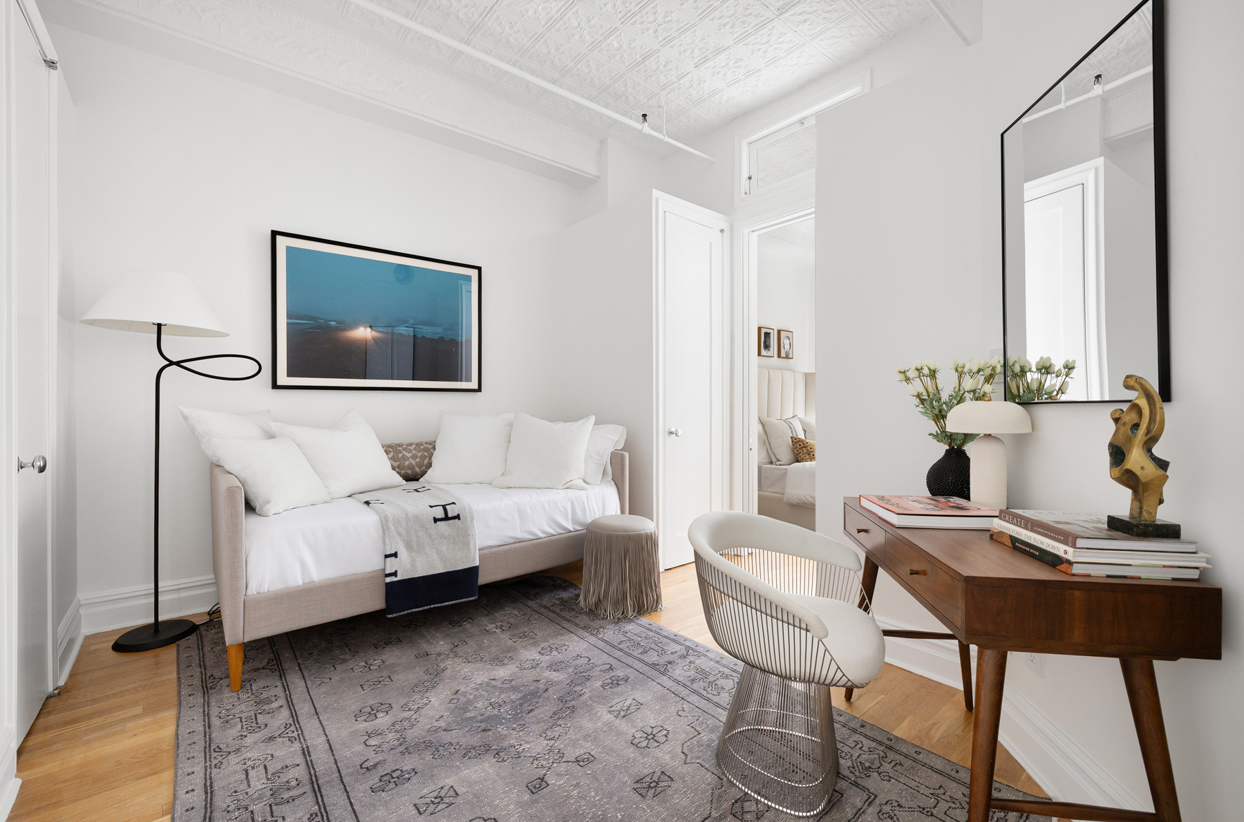 107 West 25th Street, Unit 5B Manhattan, NY 10001 - Photo 10 of 16 a living room with furniture and wooden floor