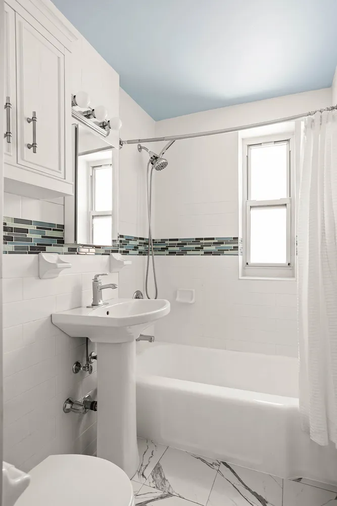 a bathroom with a sink a toilet and a bathtub