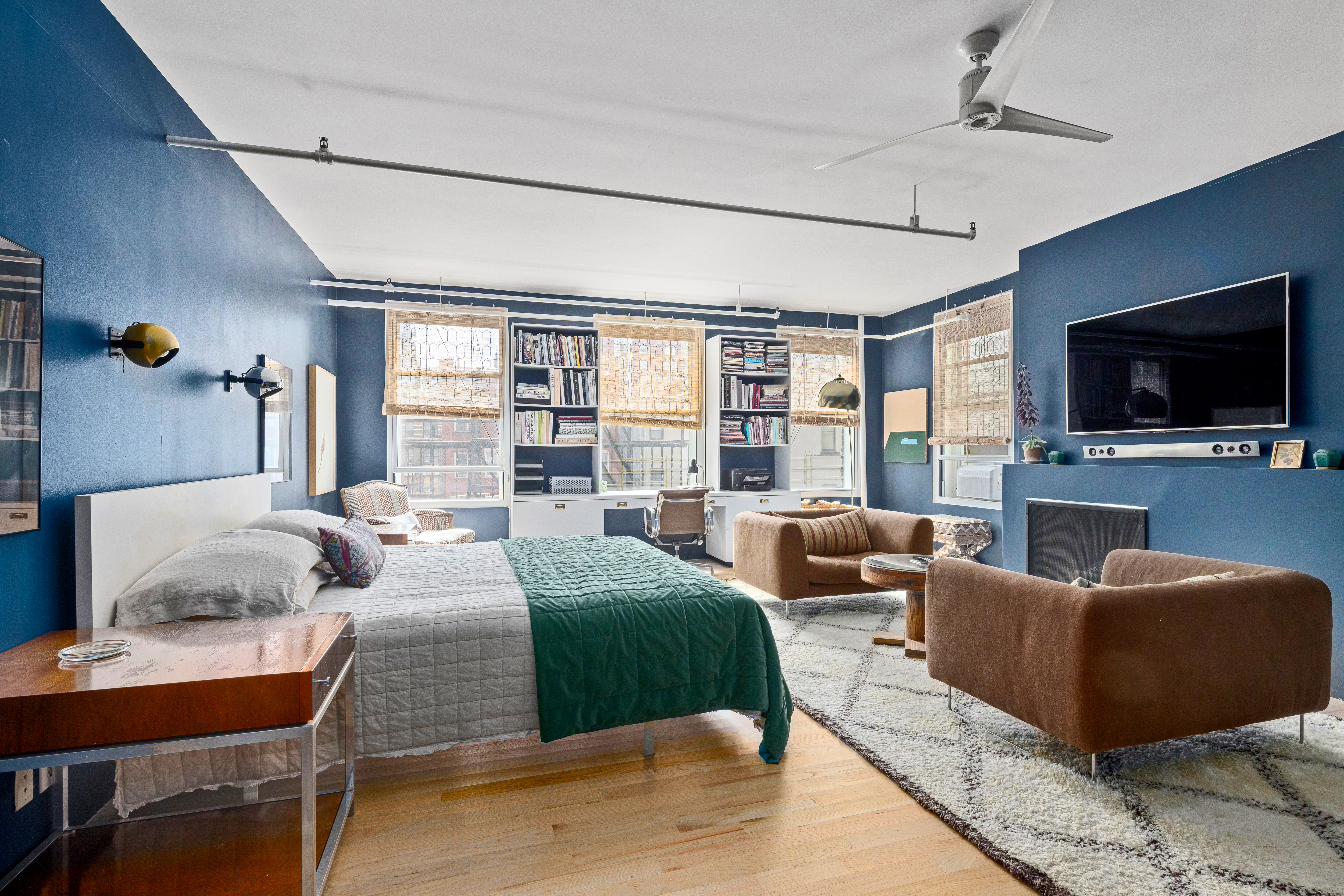 191 Chrystie Street, Unit 5R Manhattan, NY 10002 - Photo 6 of 16 a living room with furniture and a flat screen tv