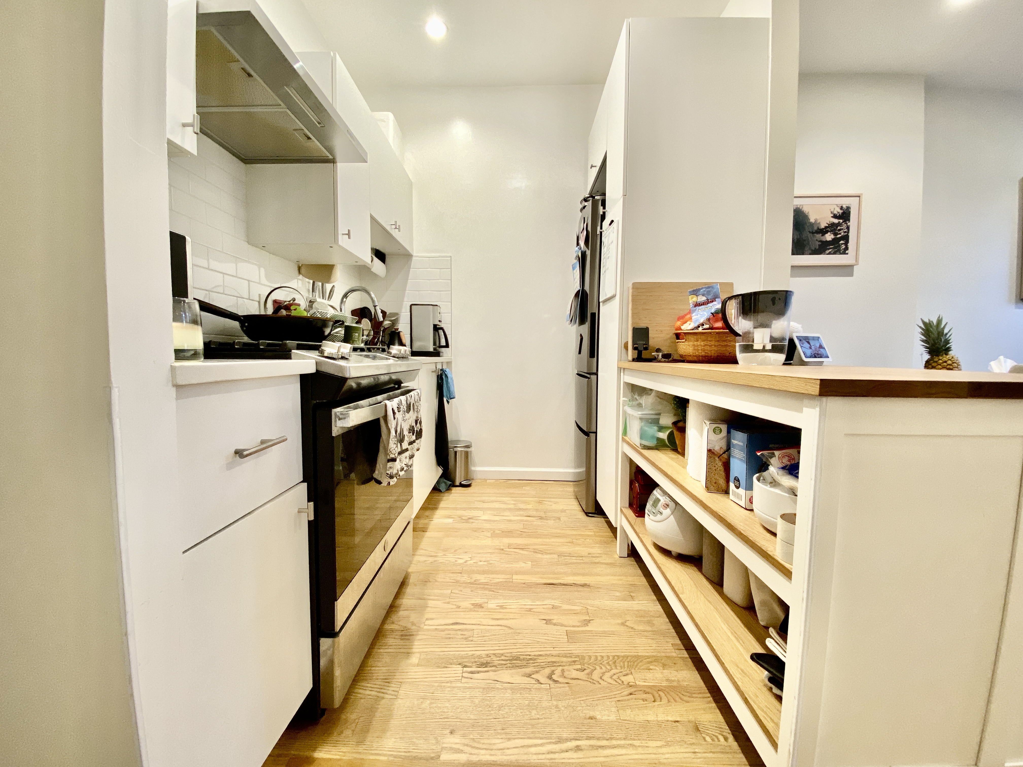 602 Madison Street, Unit 2 Brooklyn, NY 11221 - Photo 6 of 10 a kitchen with stainless steel appliances granite countertop lots of counter top space and cabinets