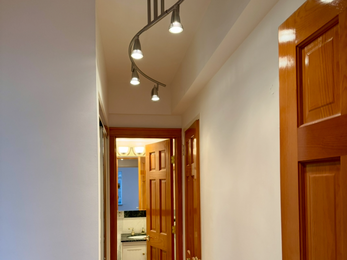 750 Park Avenue, Unit 8D Manhattan, NY 10021 - Photo 10 of 14 a view of a hallway with wooden floor