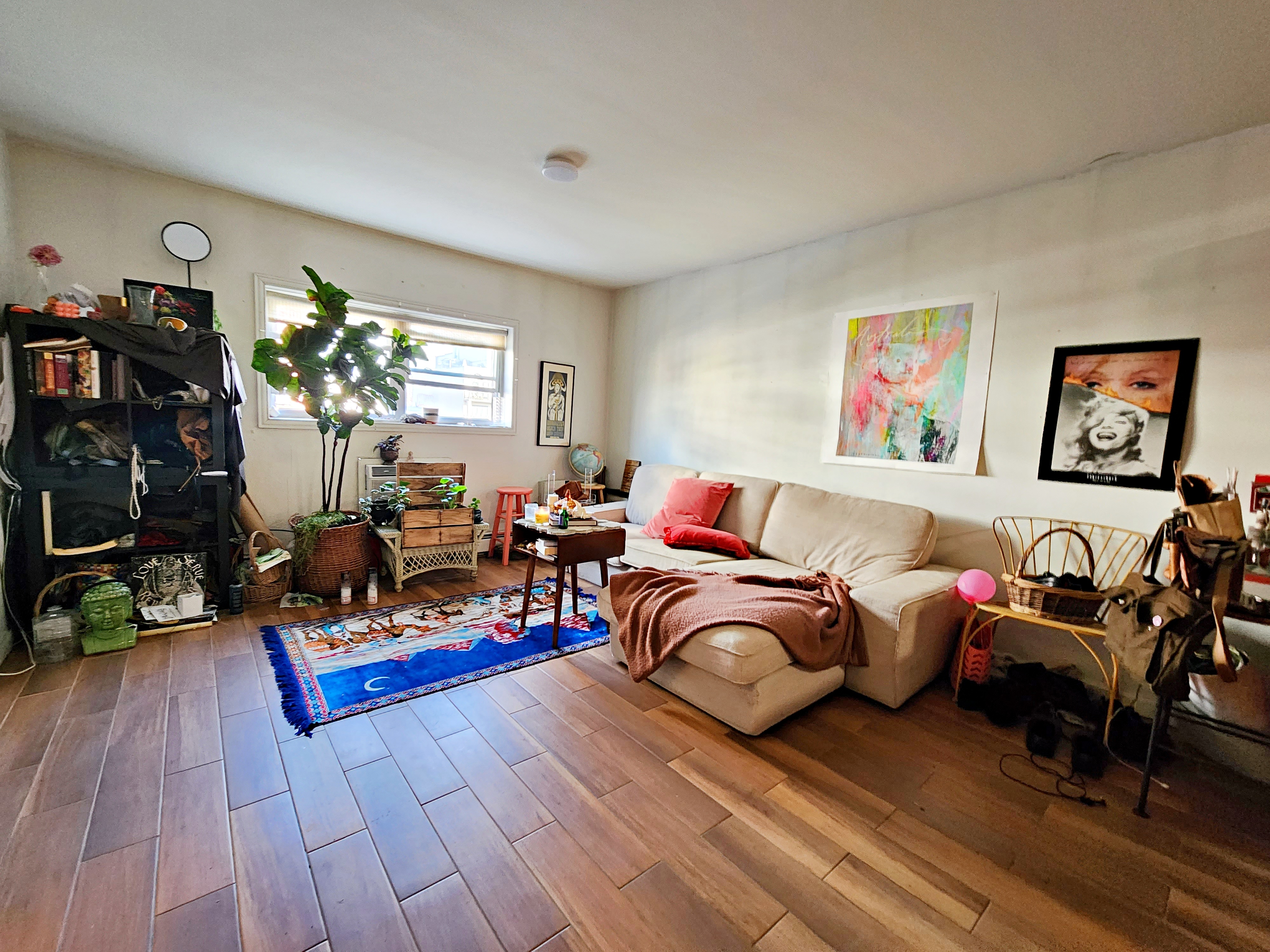 142 Frost Street, Unit 3F Brooklyn, NY 11211 - Photo 2 of 6 a living room with lots of furniture and wooden floor