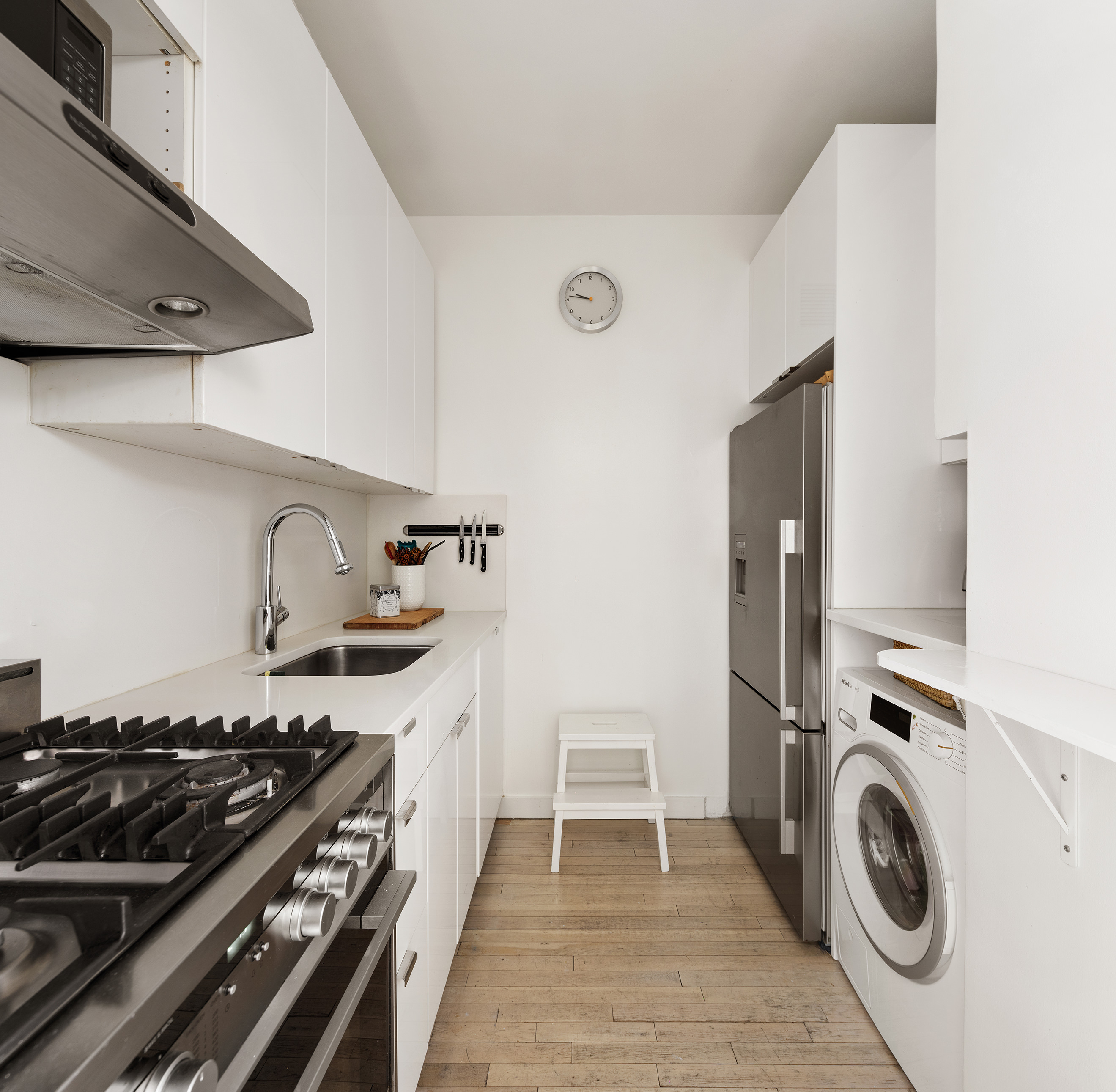 121 West 19th Street, Unit 10C Manhattan, NY 10011 - Photo 7 of 14 a kitchen with a stove and a sink
