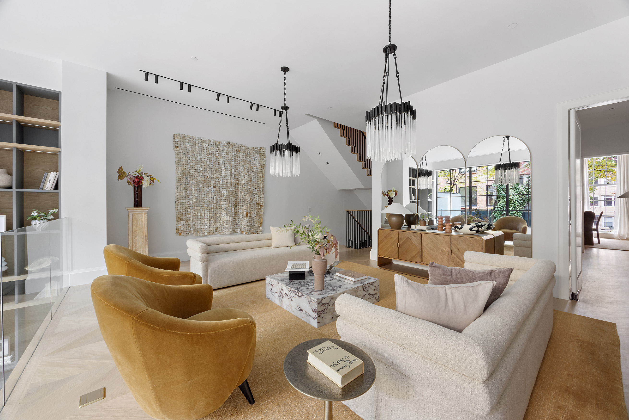 17 East 9th Street Manhattan, NY 10003 - Photo 4 of 32 a living room with furniture a chandelier and a chandelier