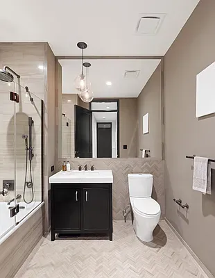 a spacious bathroom with a bathtub shower sink and mirror