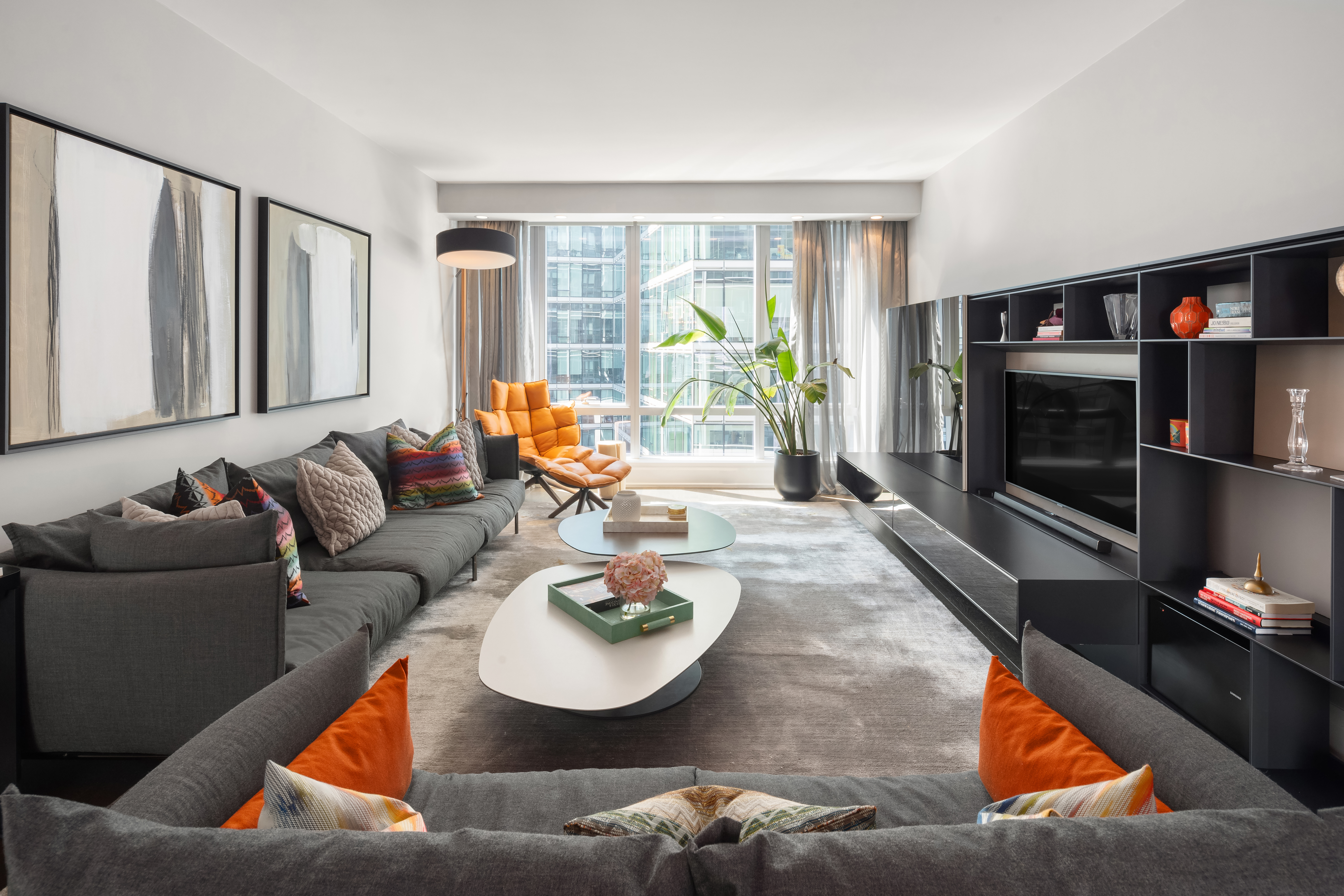 a living room with furniture and a fireplace