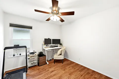 a workspace with furniture and wooden floor