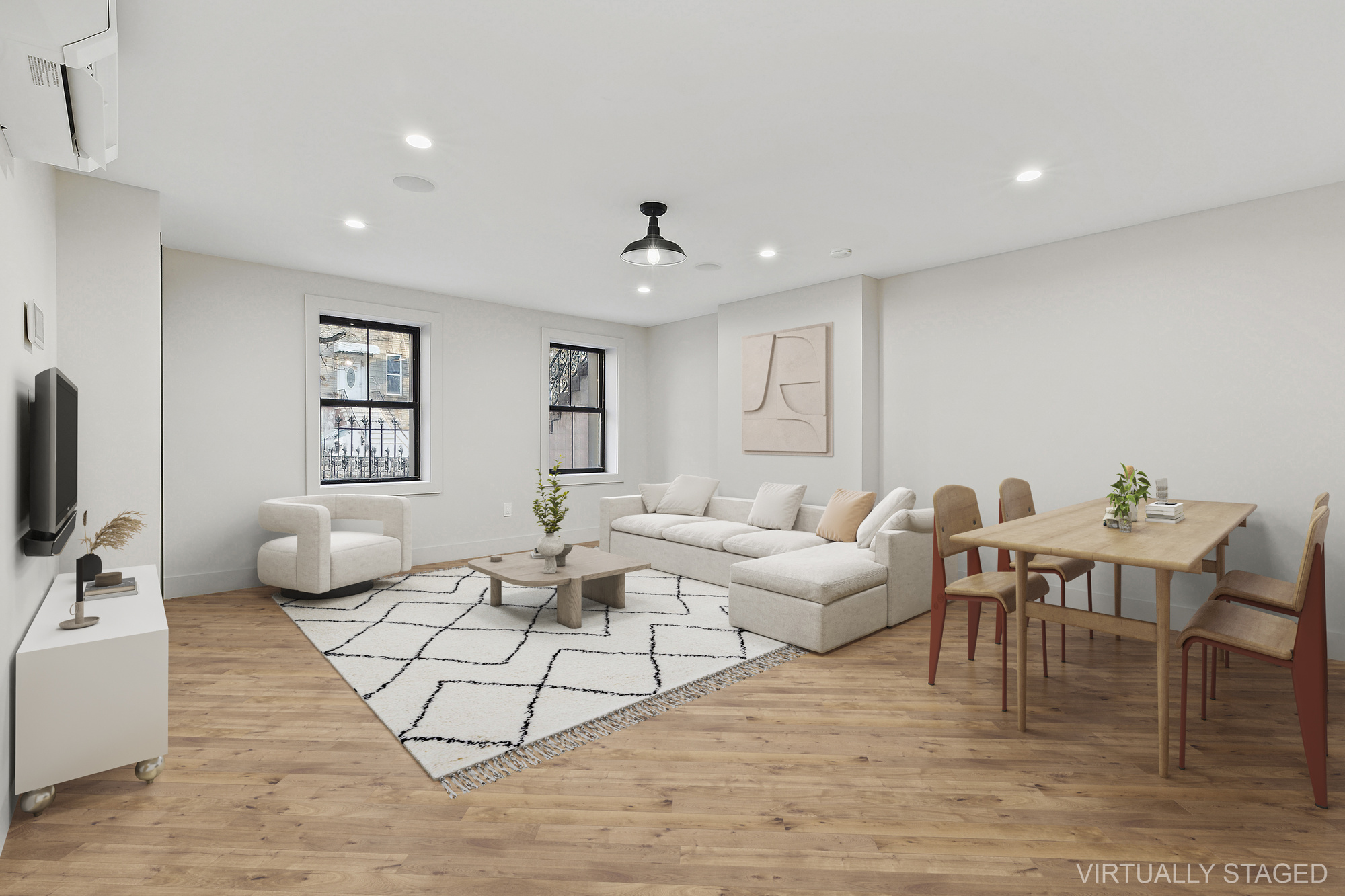 a living room with furniture and wooden floor
