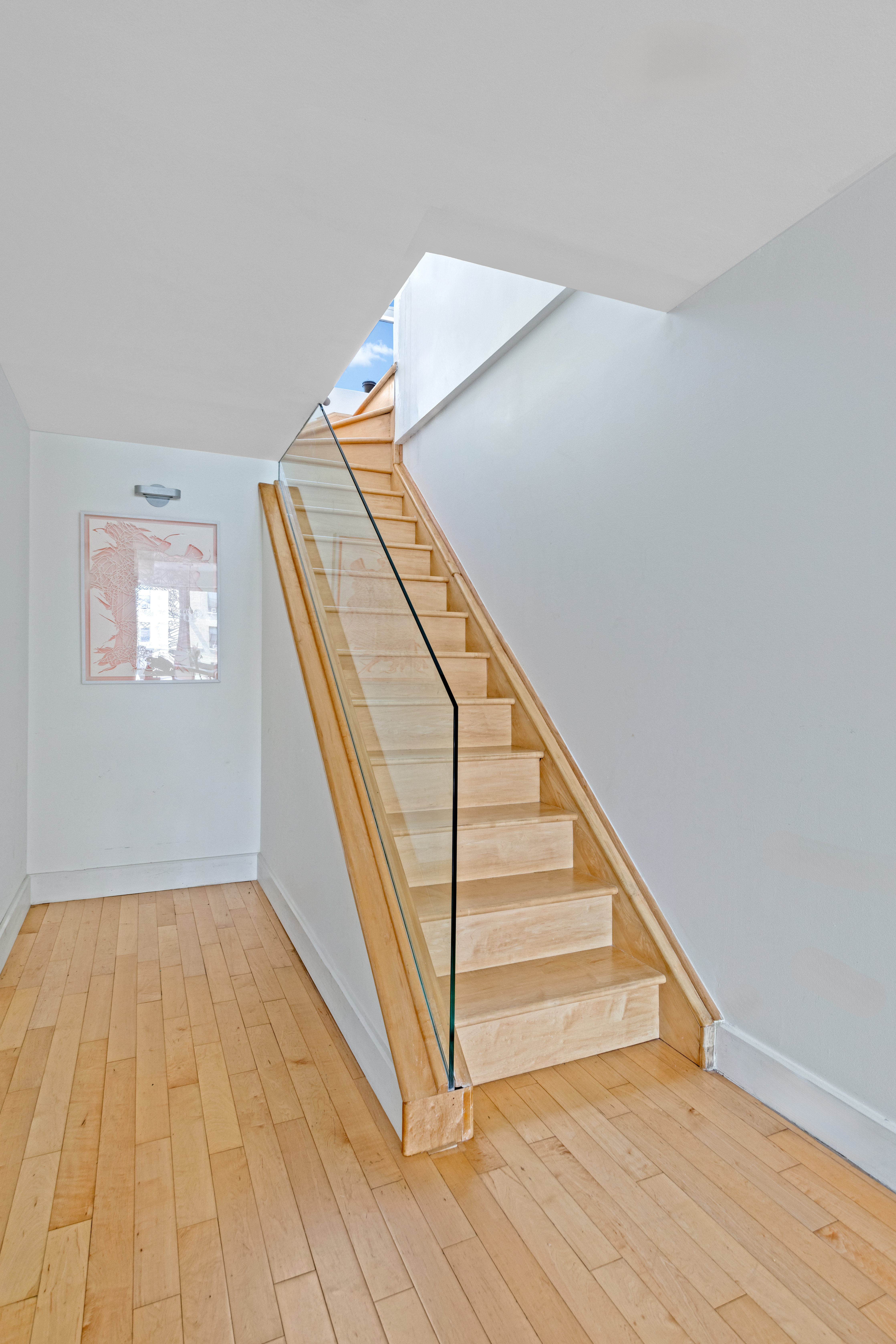 146-148 West 22nd Street, Unit PH Manhattan, NY 10011 - Photo 9 of 12 a view of entryway and hall with wooden floor