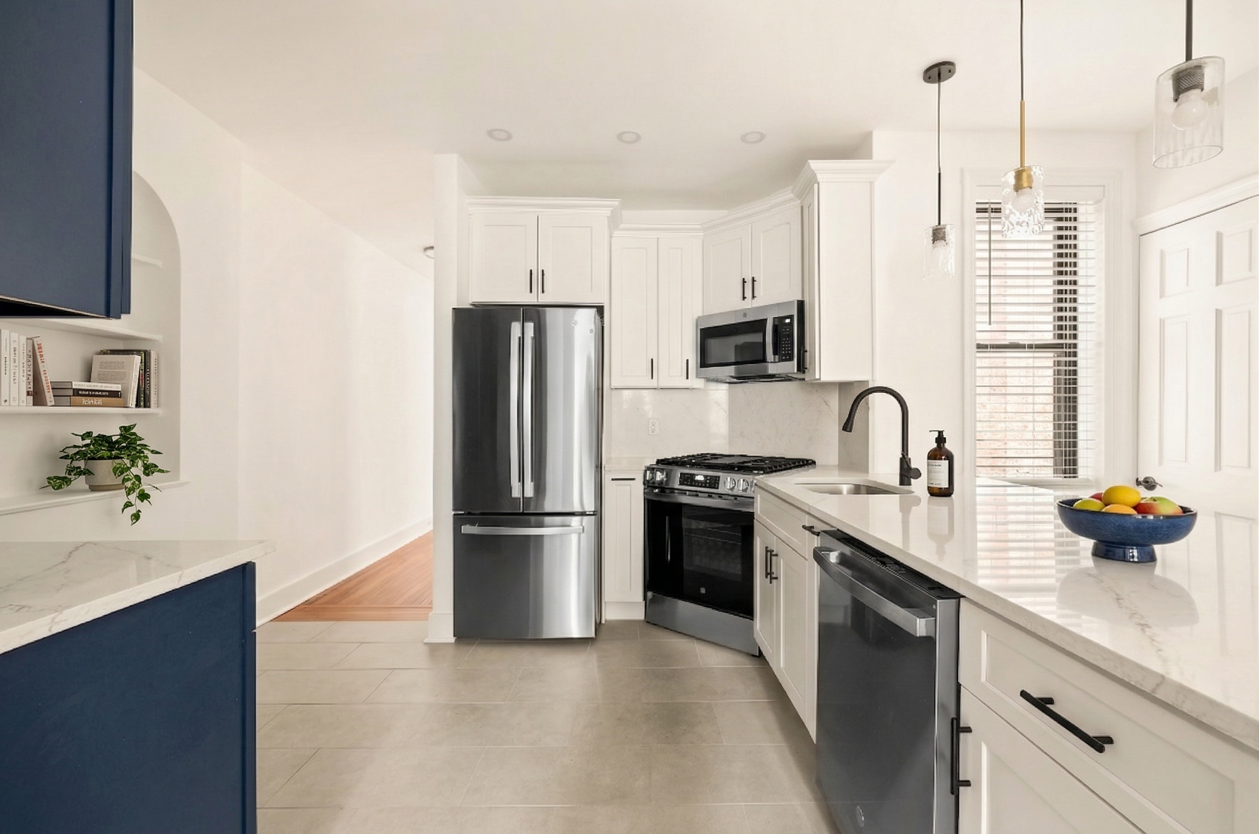 47-39 40th Street, Unit 2G Queens, NY 11104 - Photo 2 of 15 a kitchen with stainless steel appliances granite countertop a refrigerator a sink a stove and white cabinets