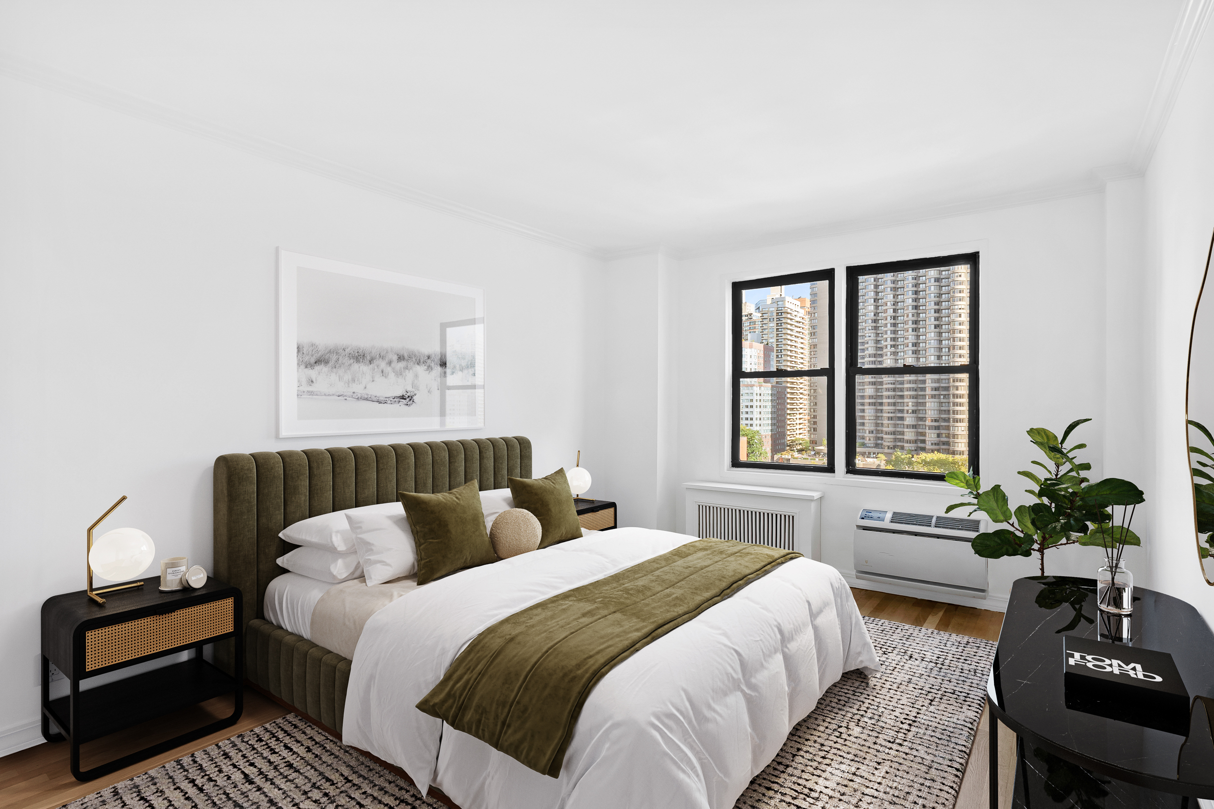 333 East 34th Street, Unit 14D Manhattan, NY 10016 - Photo 6 of 11 a bedroom with a bed and a couch