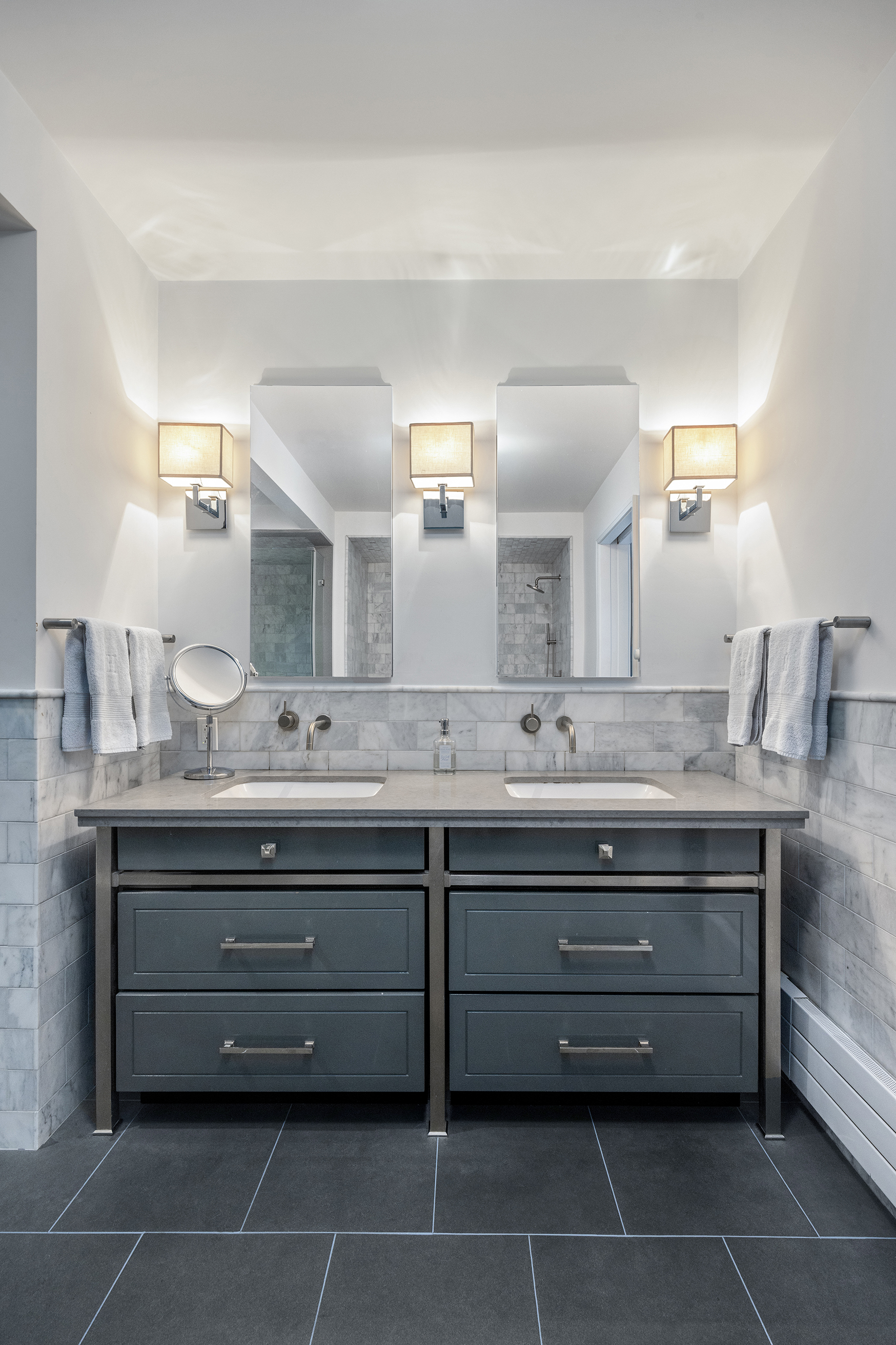 52 Laight Street, Unit R2 Manhattan, NY 10013 - Photo 11 of 21 a bathroom with a granite countertop sink a mirror and shower