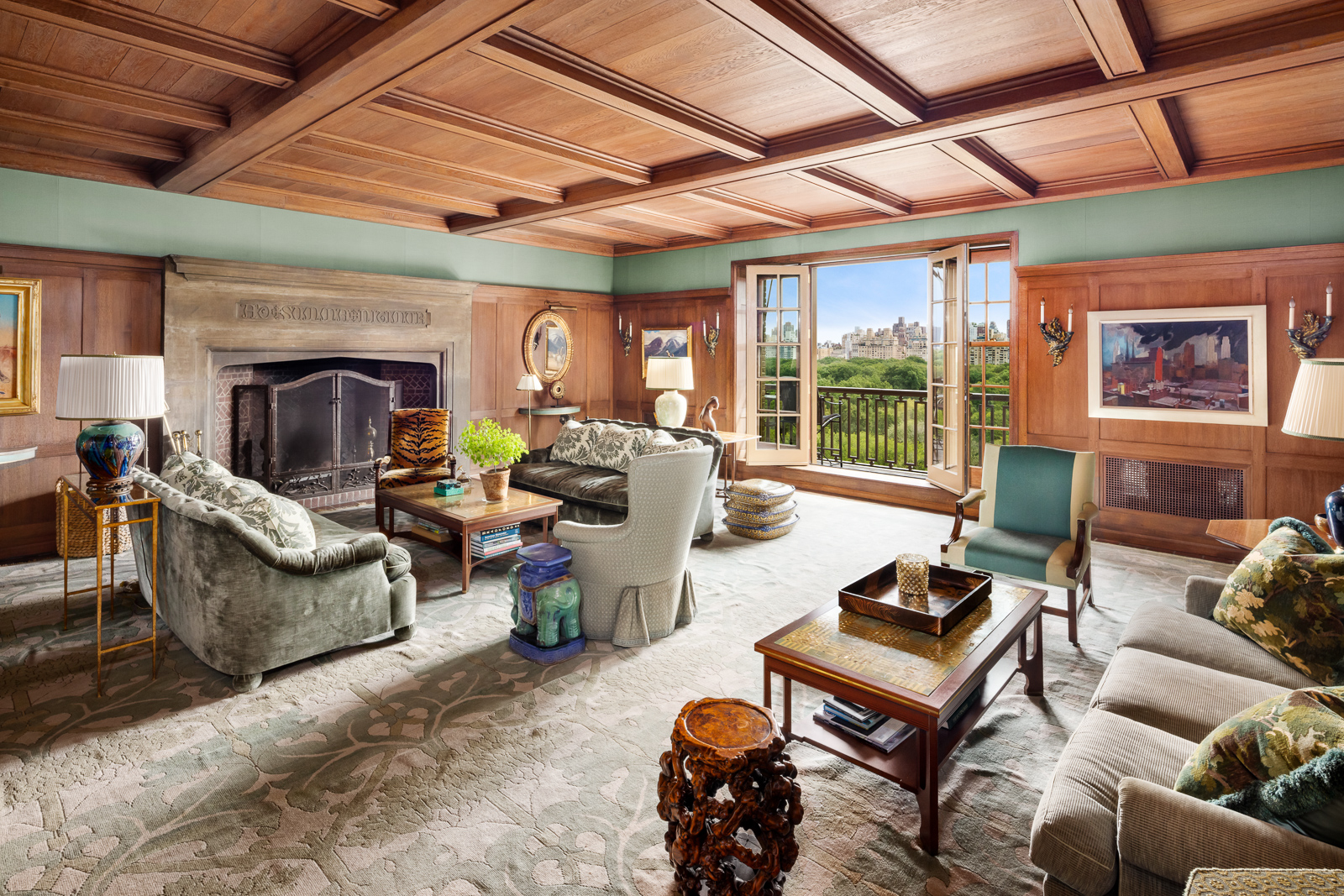 41 Central Park West, Unit 11A Manhattan, NY 10023 - Photo 2 of 17 a living room with furniture a fireplace and a table