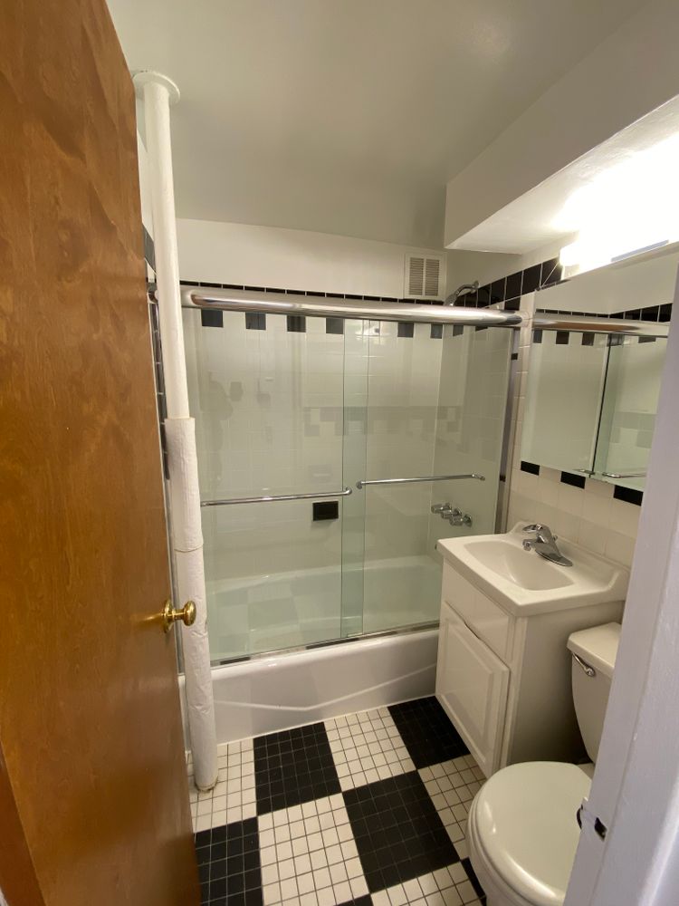 754 Greenwich Street, Unit 1A Manhattan, NY 10014 - Photo 6 of 6 a bathroom with a sink a toilet and shower